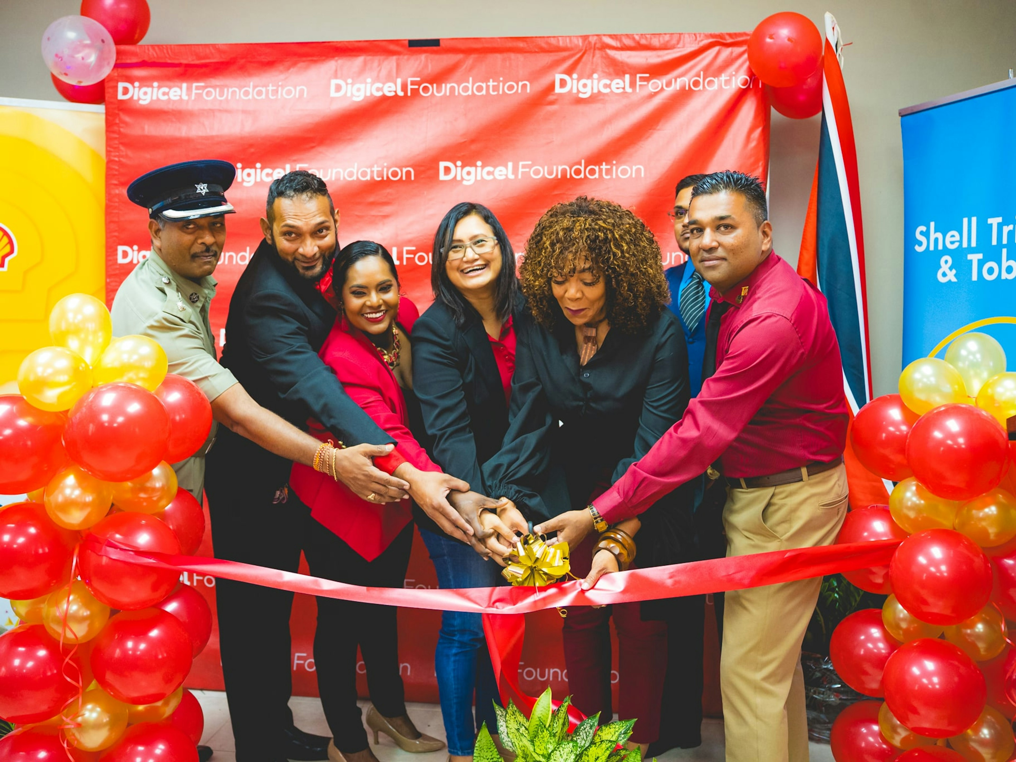 Partners cutting ribbon at a community launch
