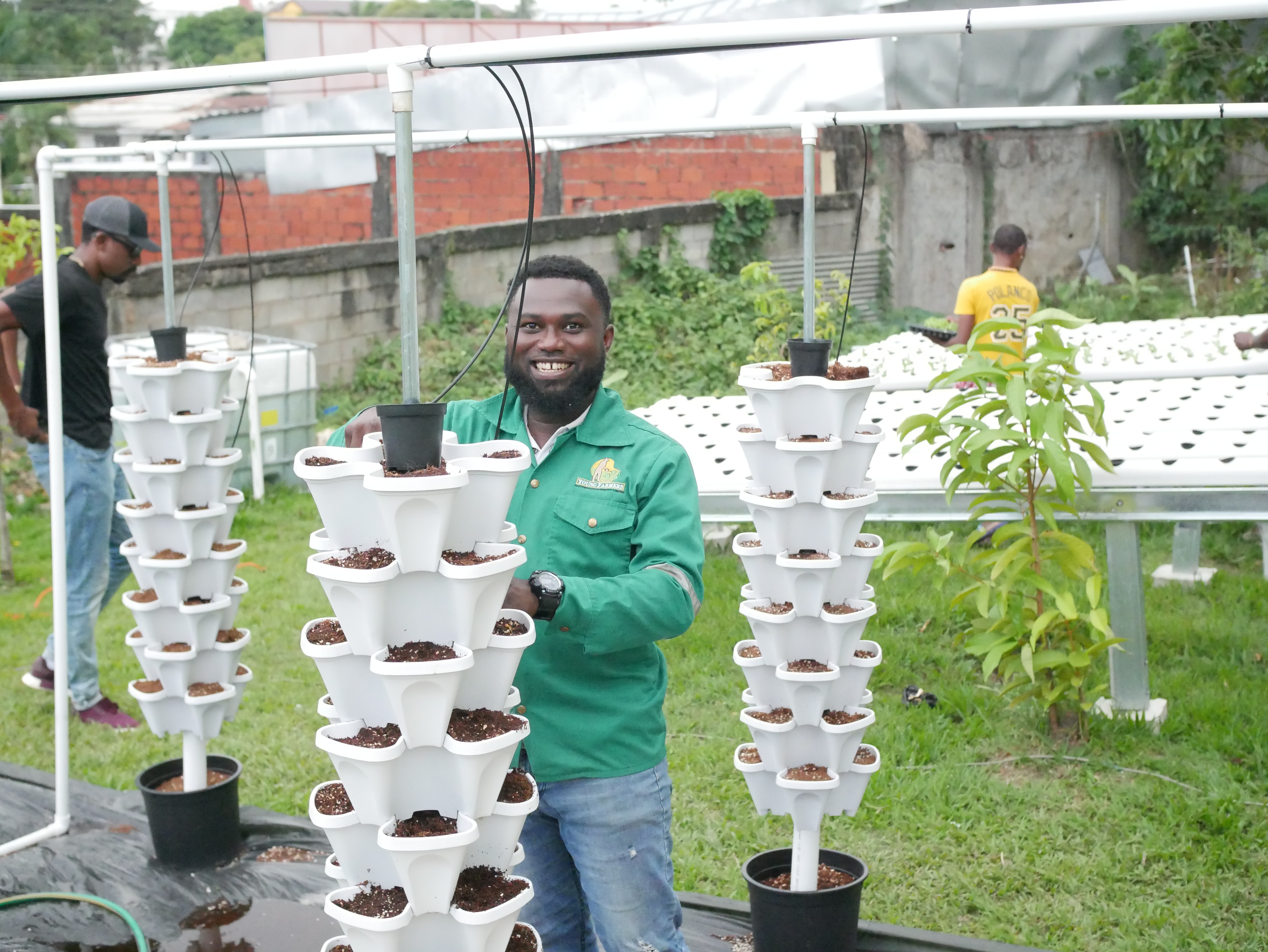 Partner setting up vertical hydroponics units