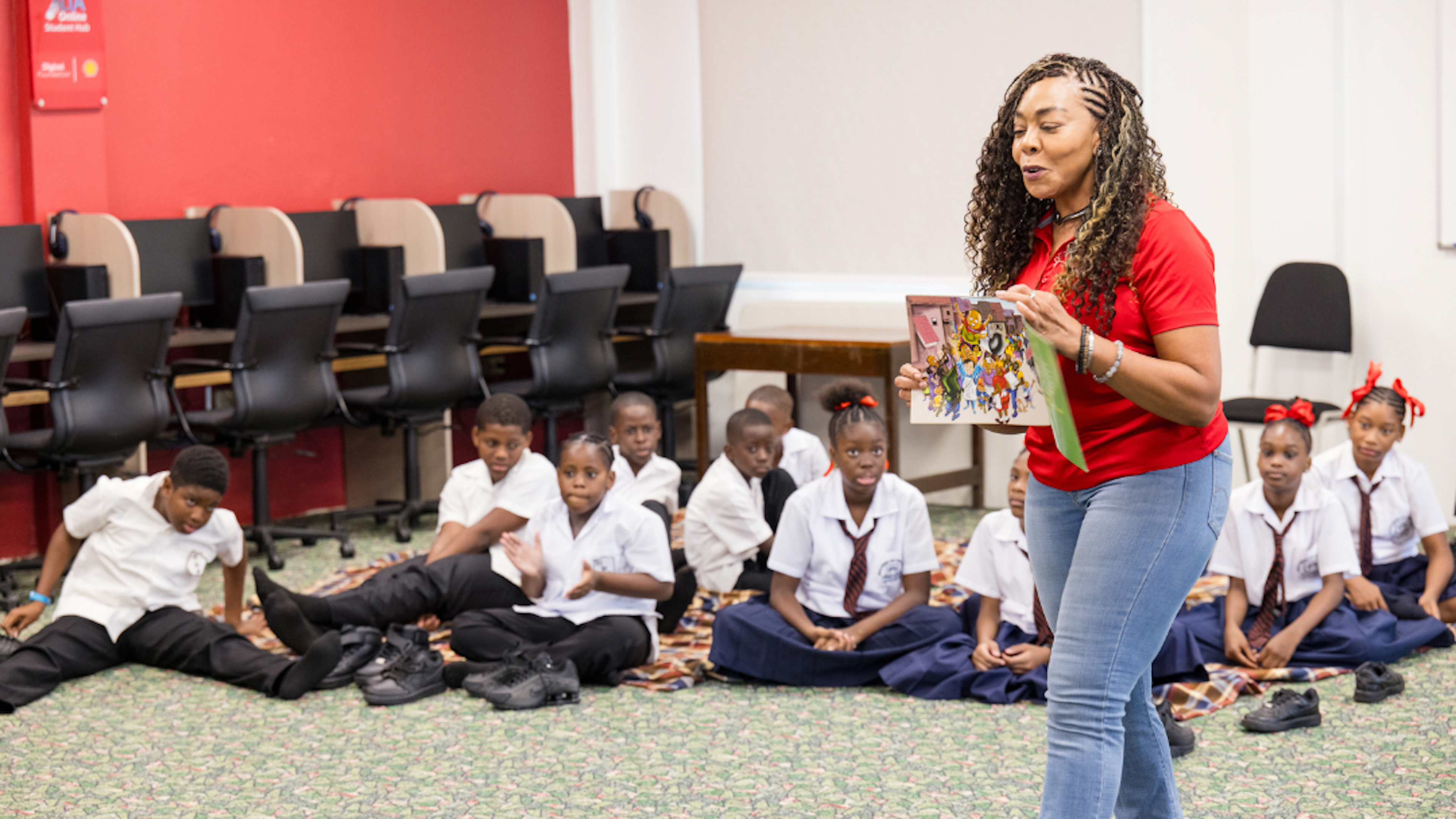 Digicel Foundation CEO reading to students