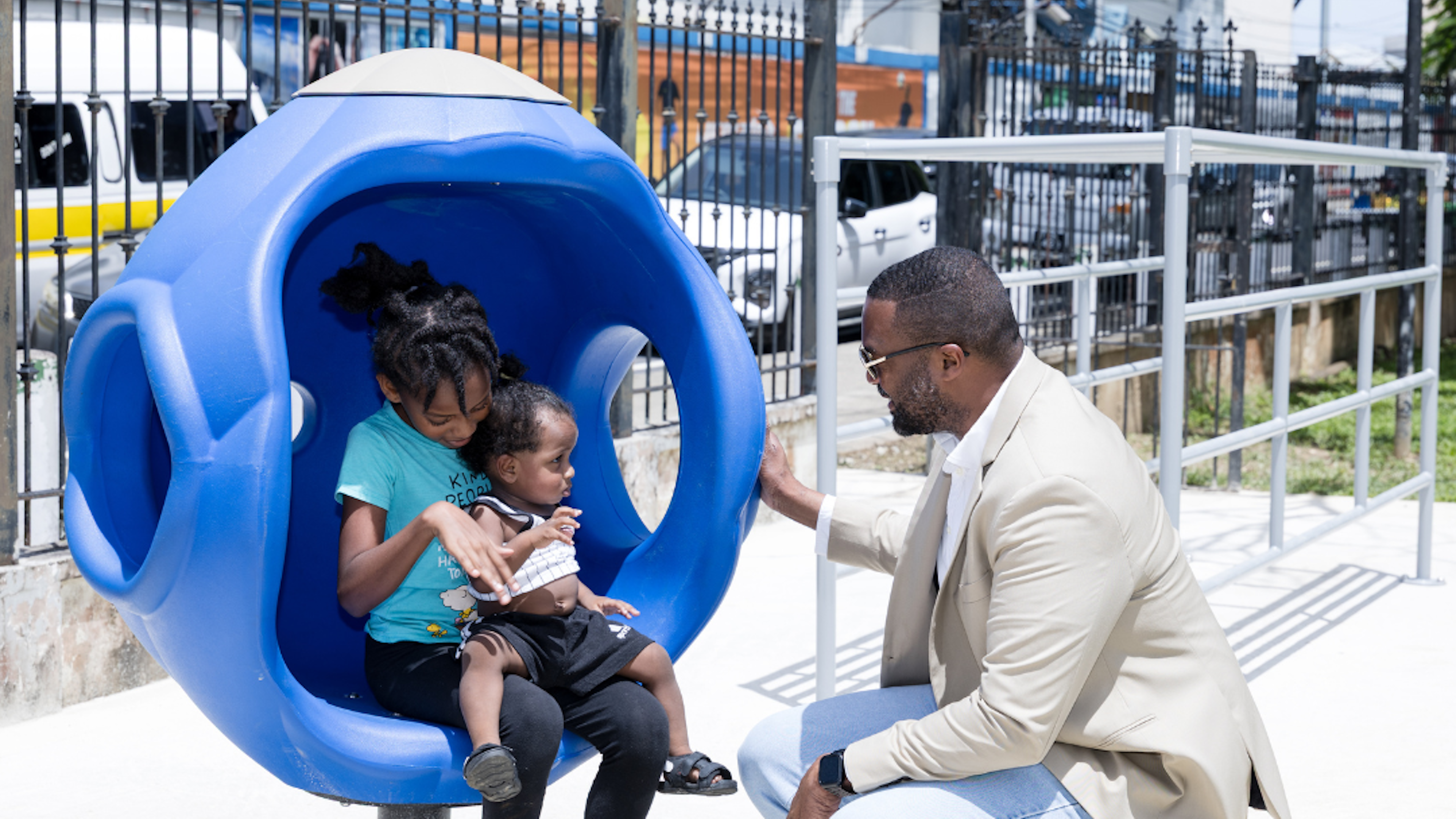 PoS mayor at park talking to two children