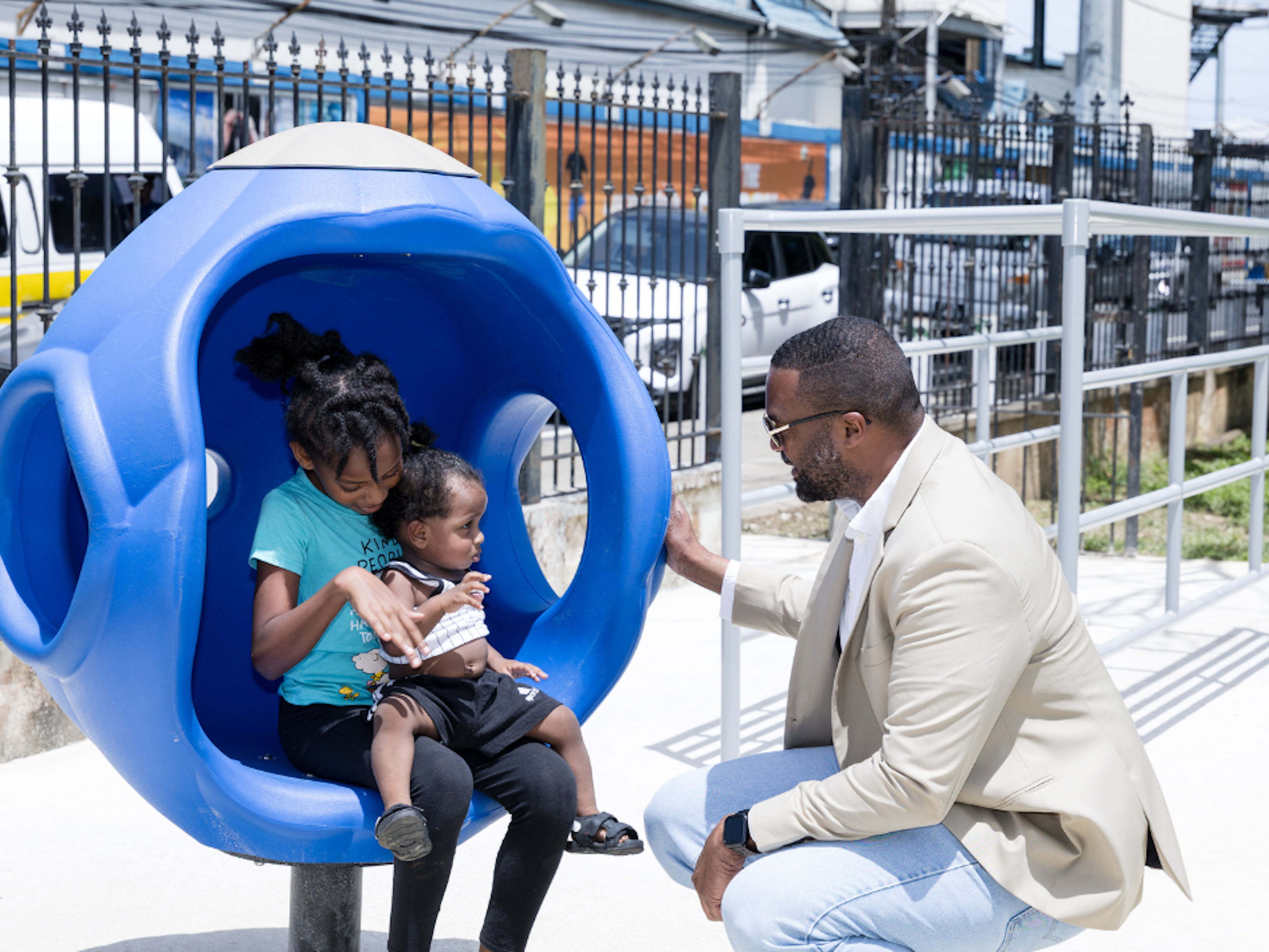 PoS mayor at park talking to two children