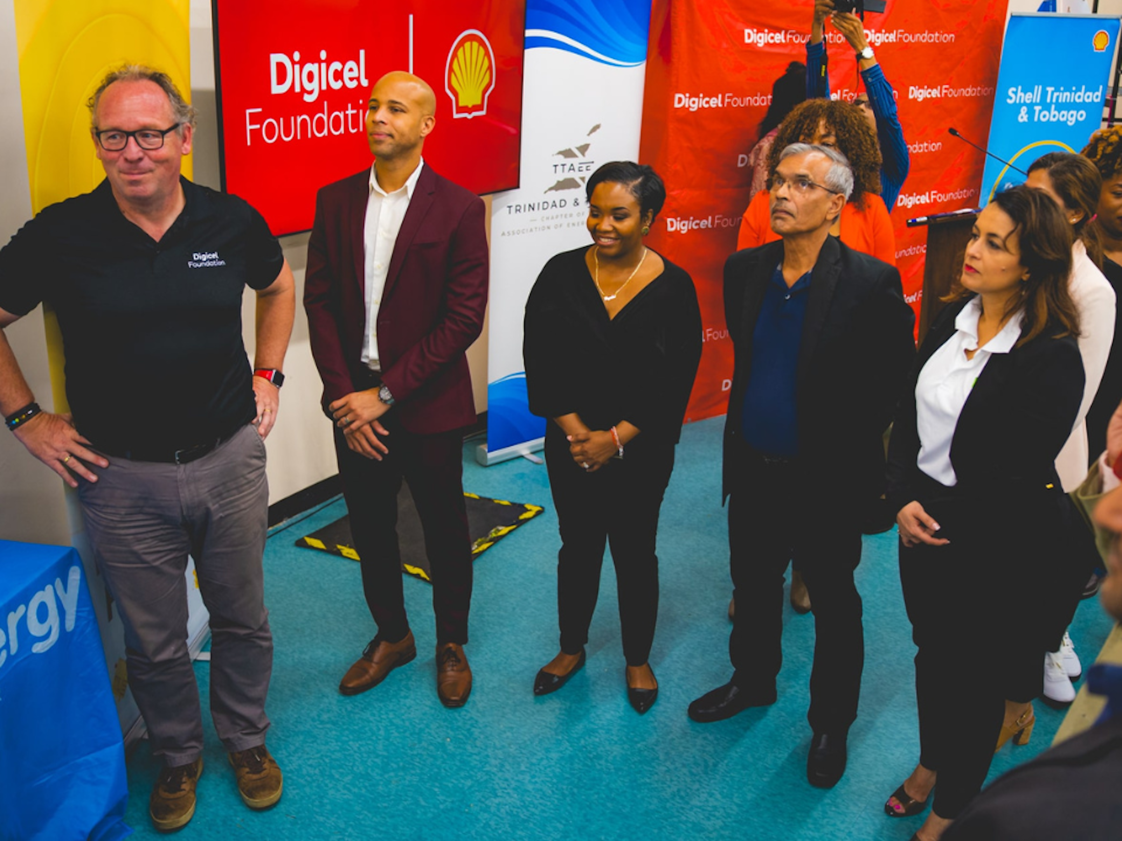 Stakeholders stand around new energy saving equipment