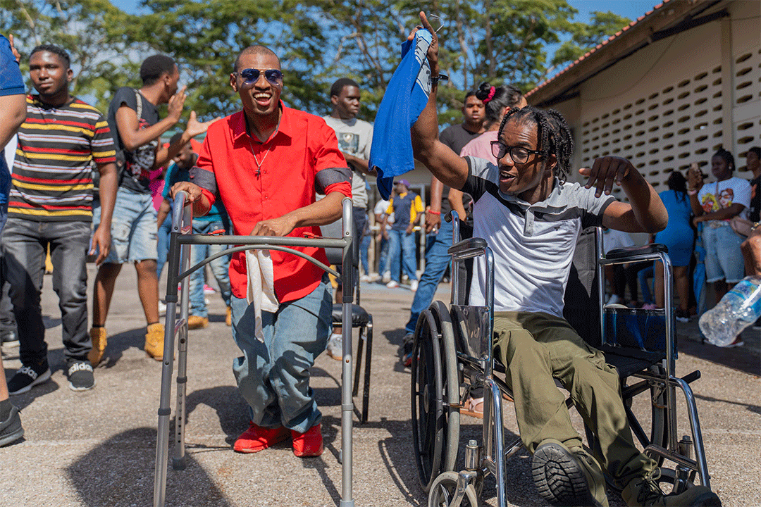two pwds participating in carnival jump up