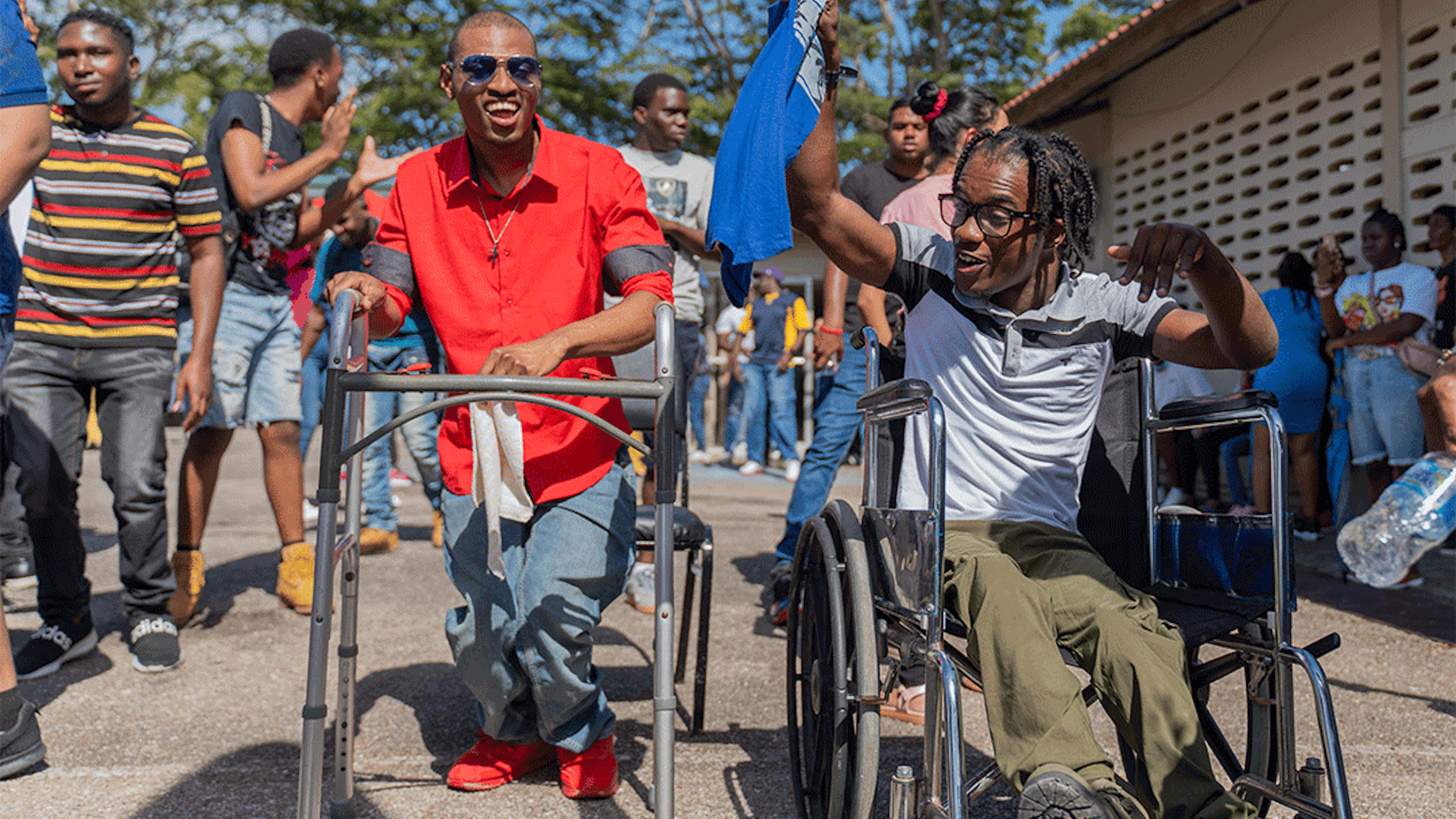 two pwds participating in carnival jump up