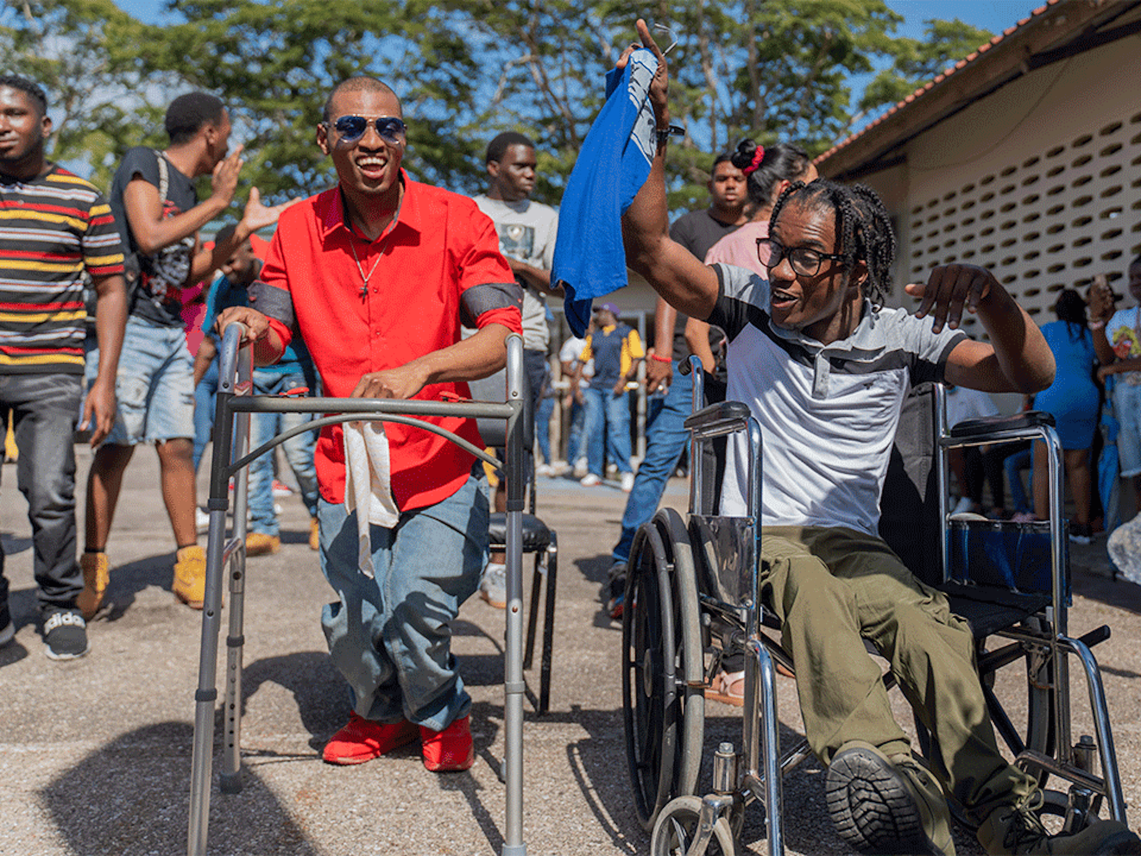 two pwds participating in carnival jump up
