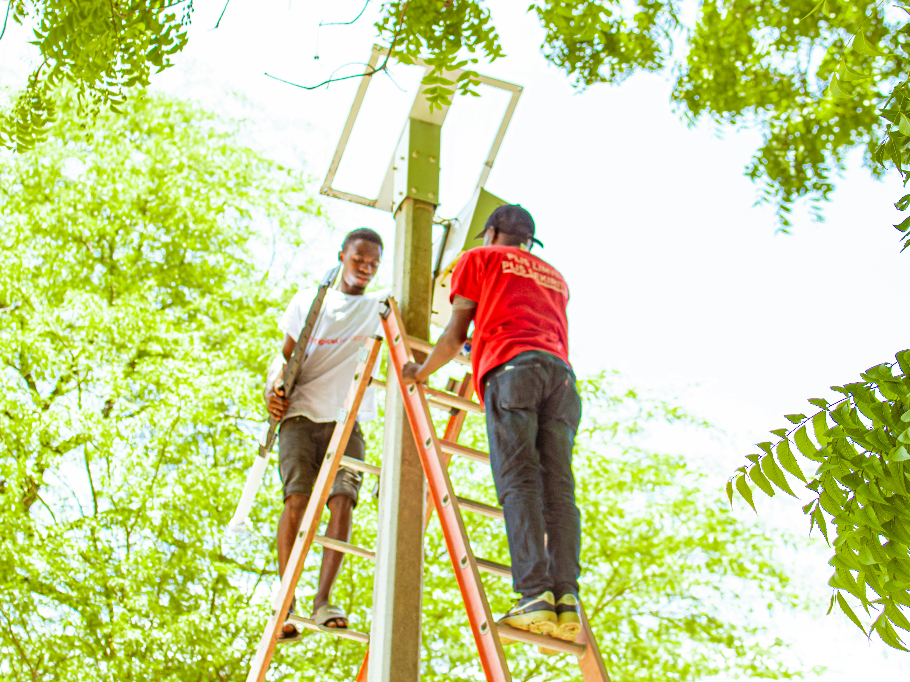 25 solar streetlights installed at Lakou Souvnans by Digicel volunteers