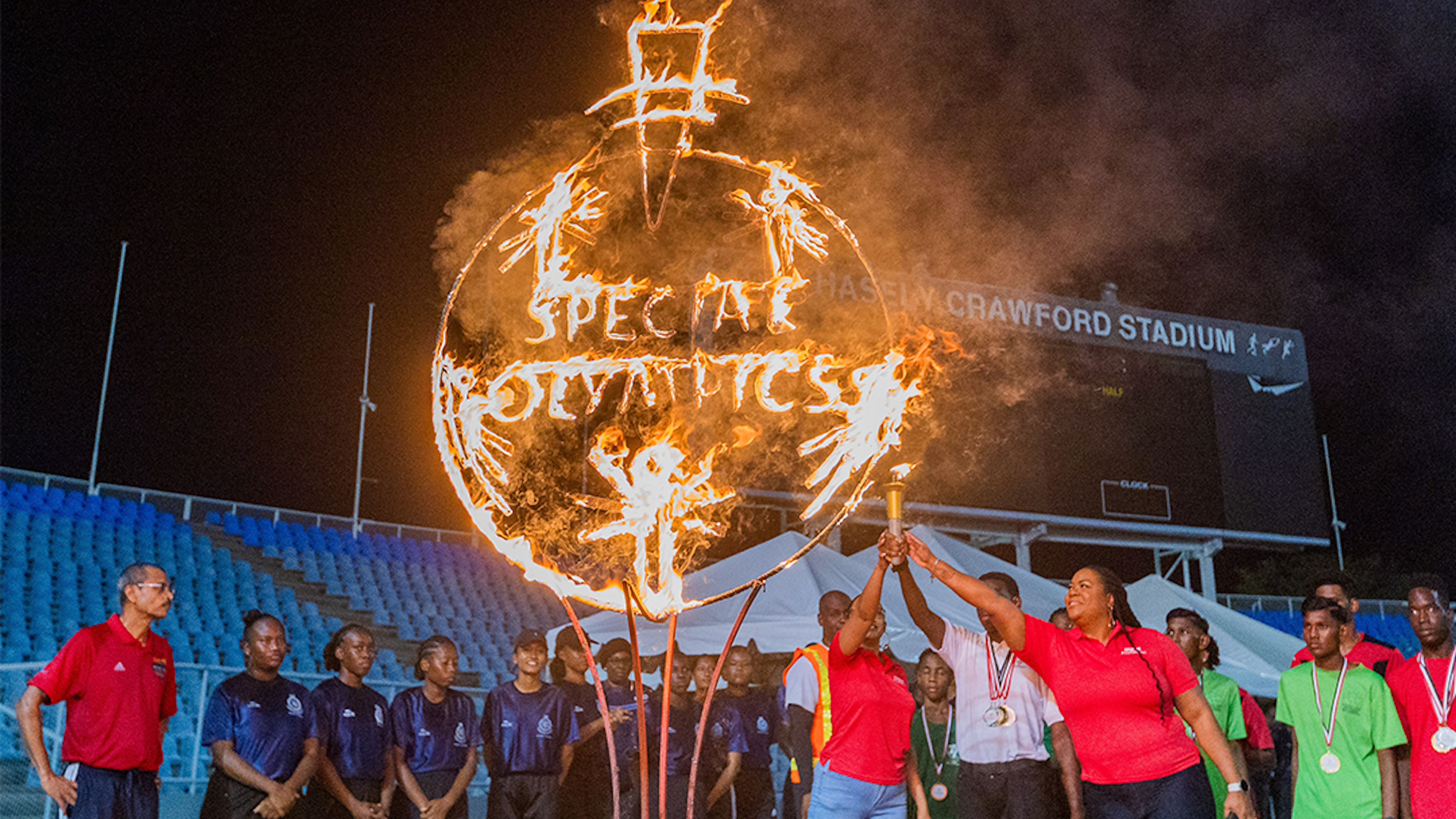 Athletes and sponsors light the SOTT torch