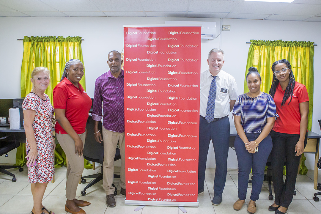 6 people pose in tech hub