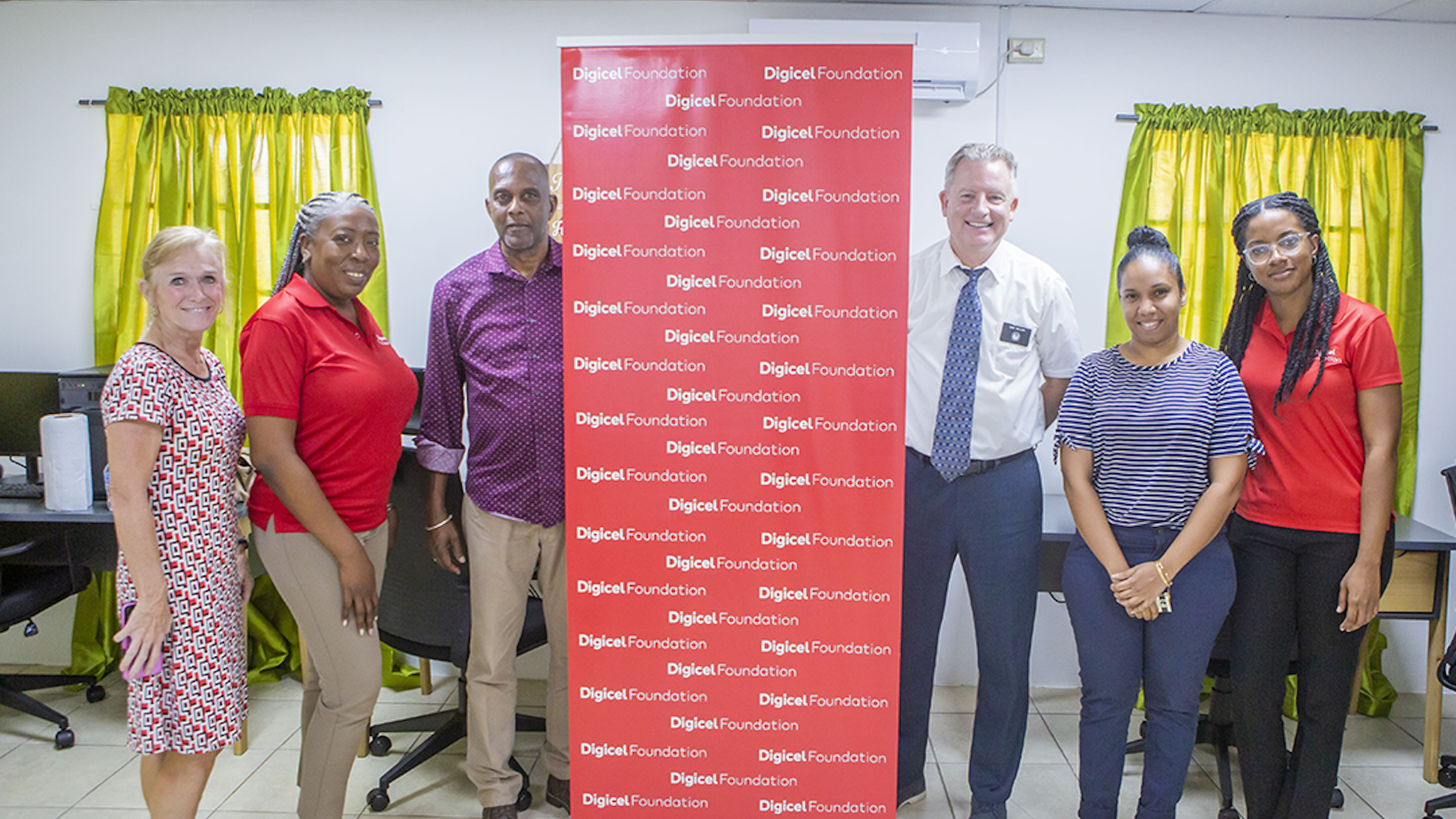 6 people pose in tech hub