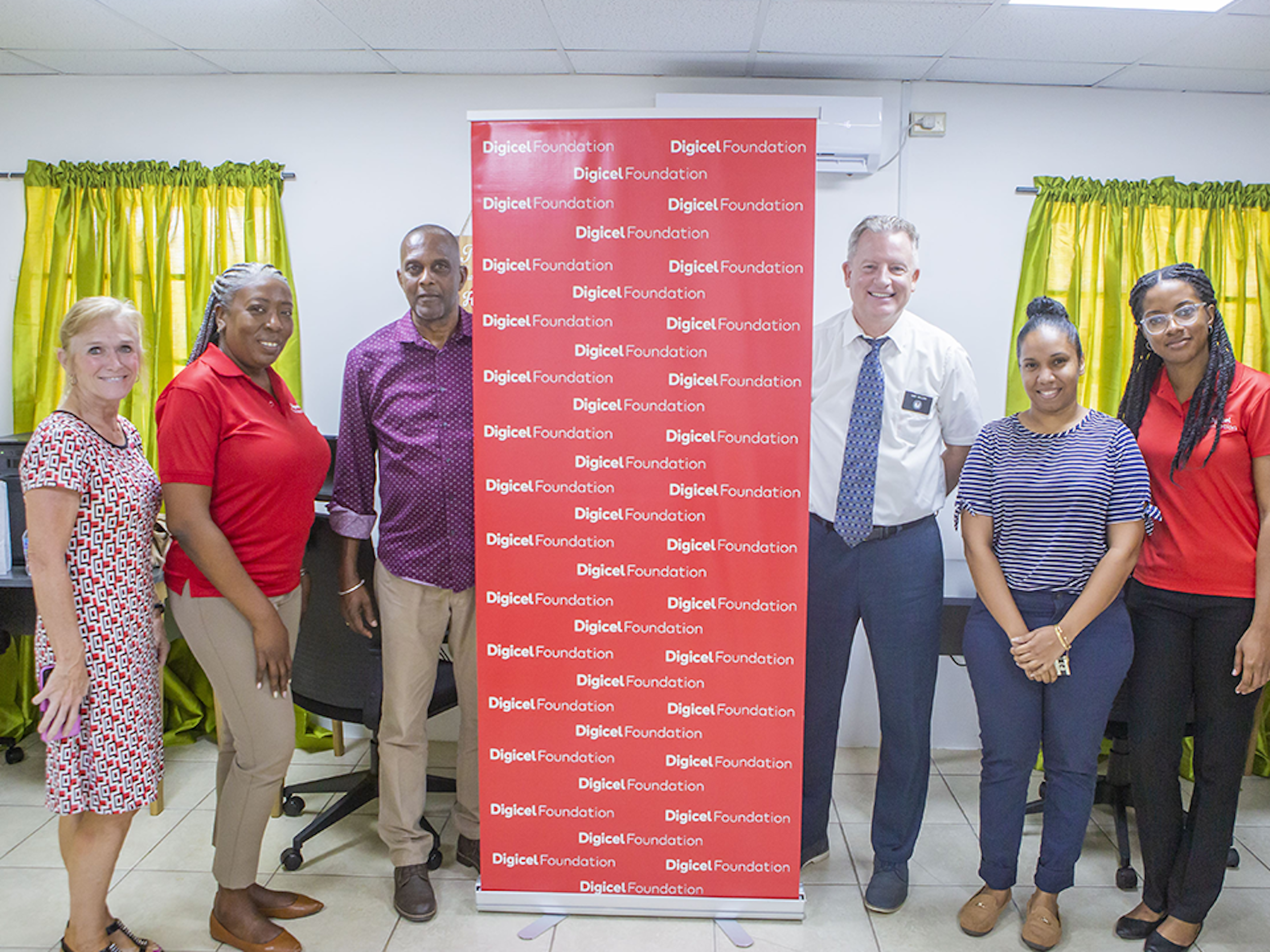 6 people pose in tech hub