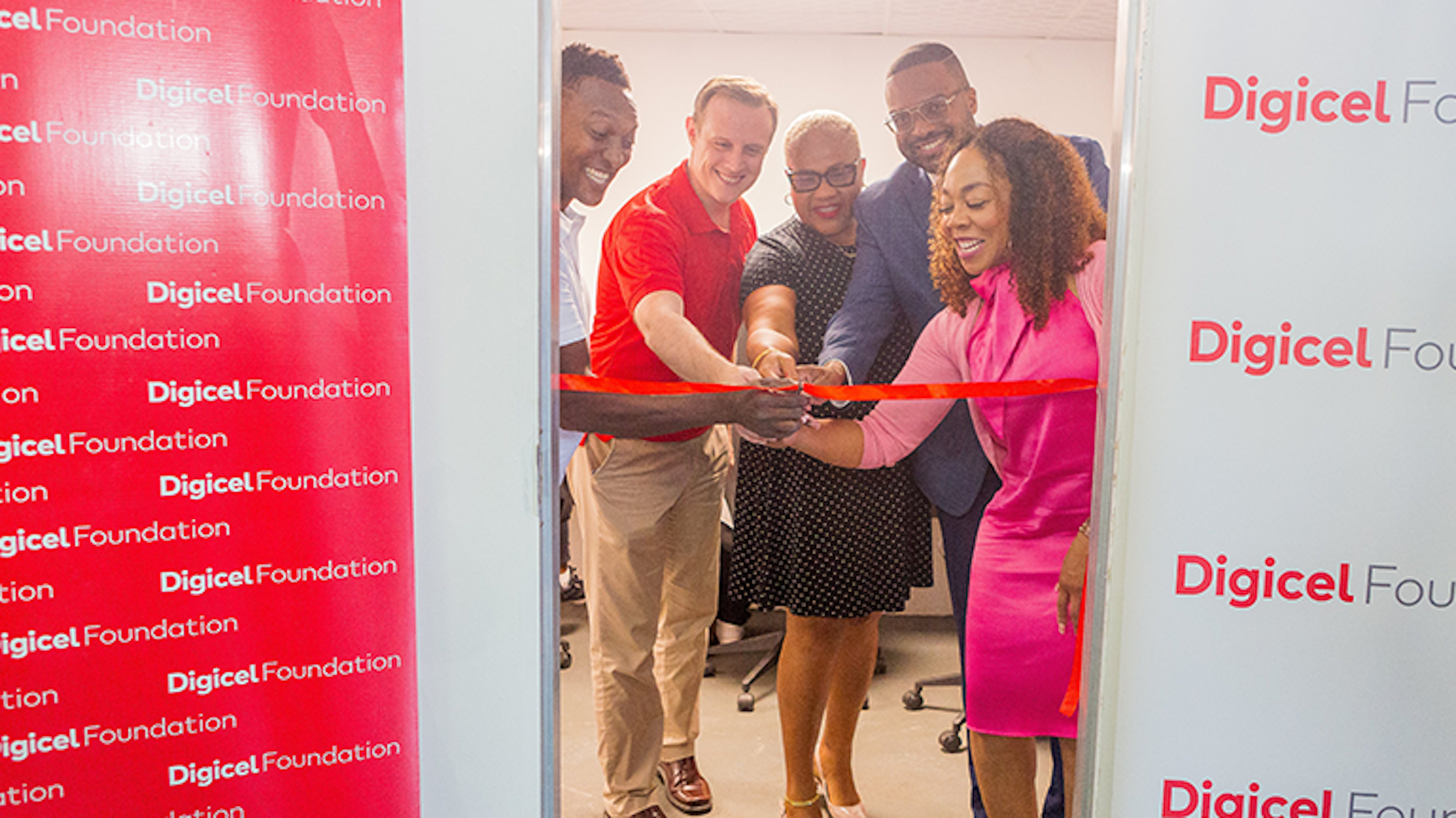 5 person cut ribbon at tech hub