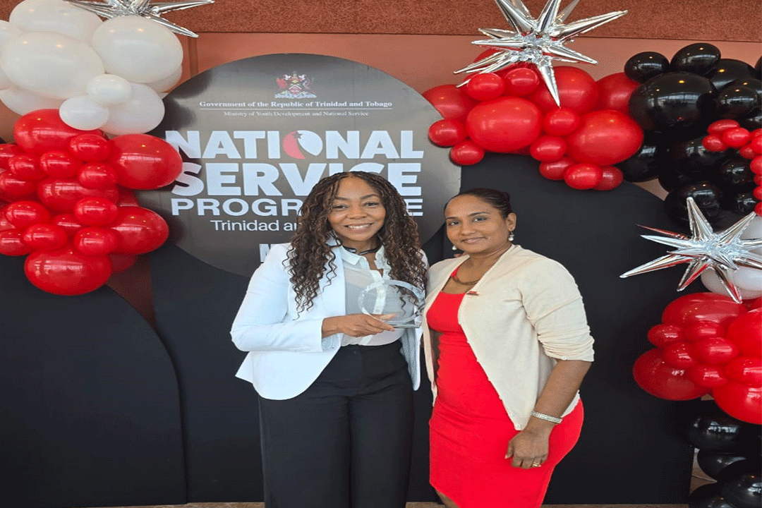 CEO Penny Gomez and Project Manager Diana Mathura Hobson holding award