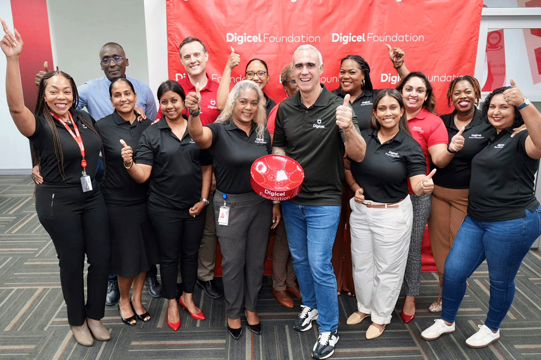 Group comprising foundation board and operational team go thumbs up with group CEO Marcello