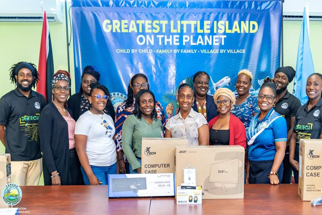 Group posing in front of tech equipment