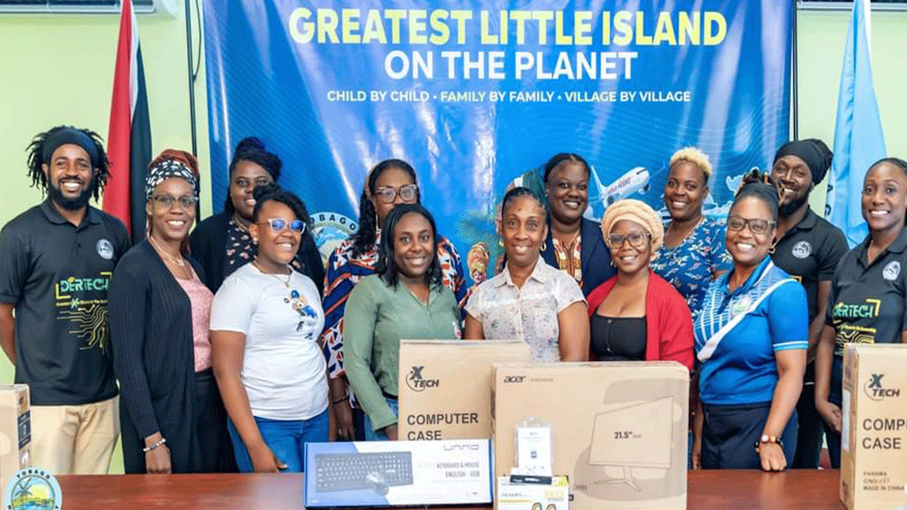 Group posing in front of tech equipment
