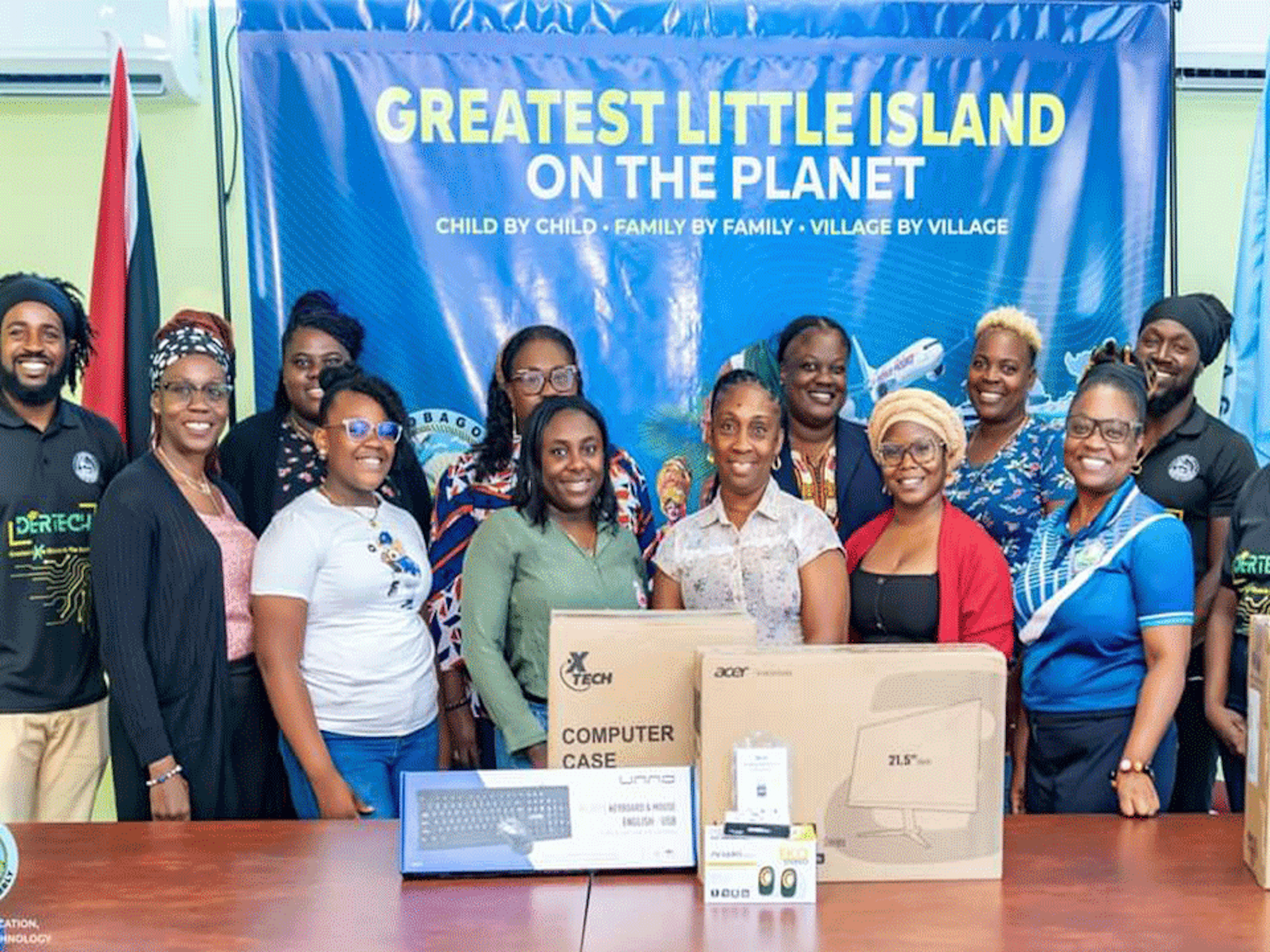 Group posing in front of tech equipment