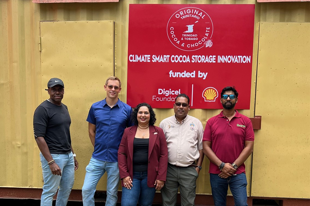 5 persons standing in front of renewable energy project