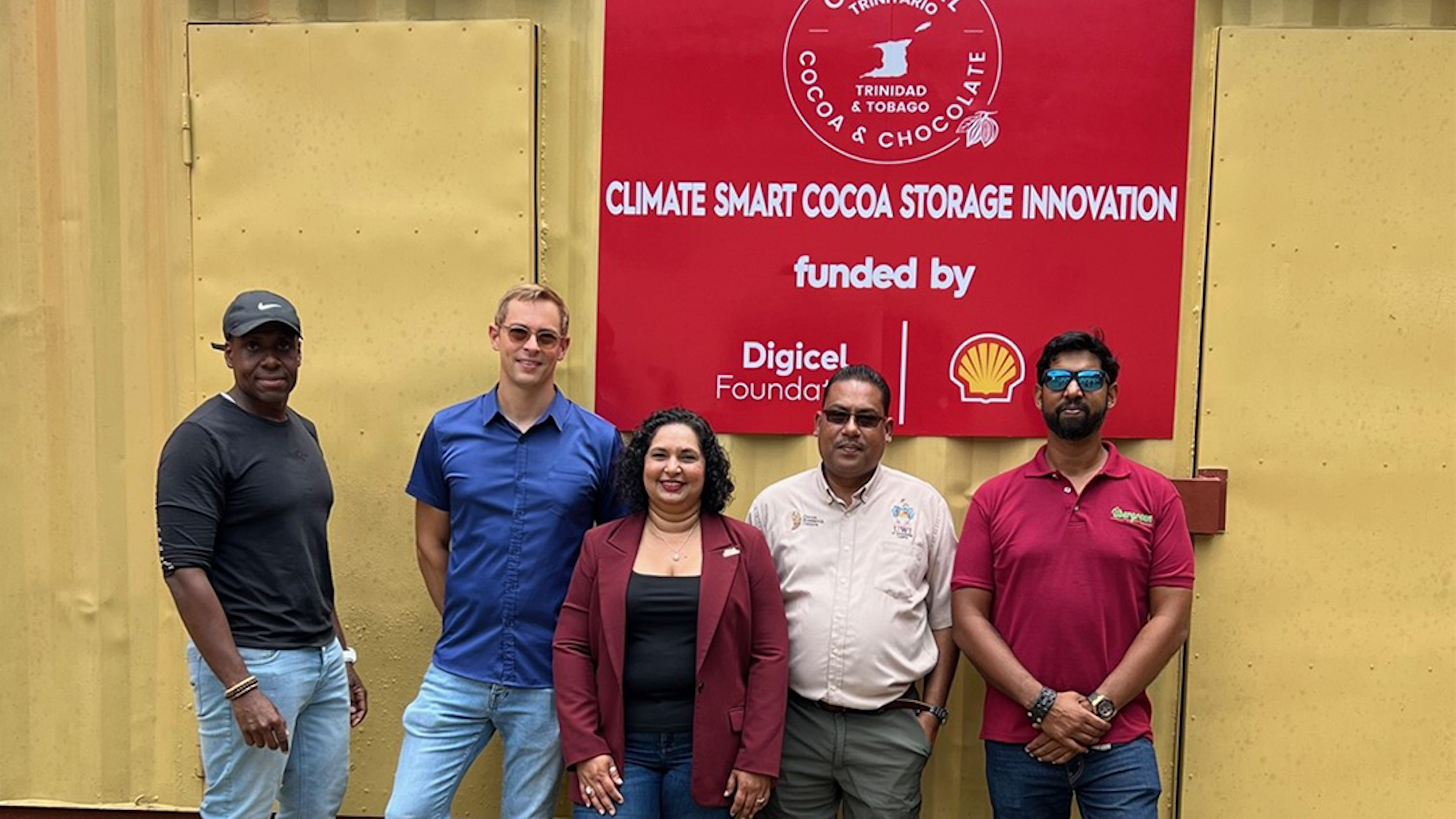 5 persons standing in front of renewable energy project