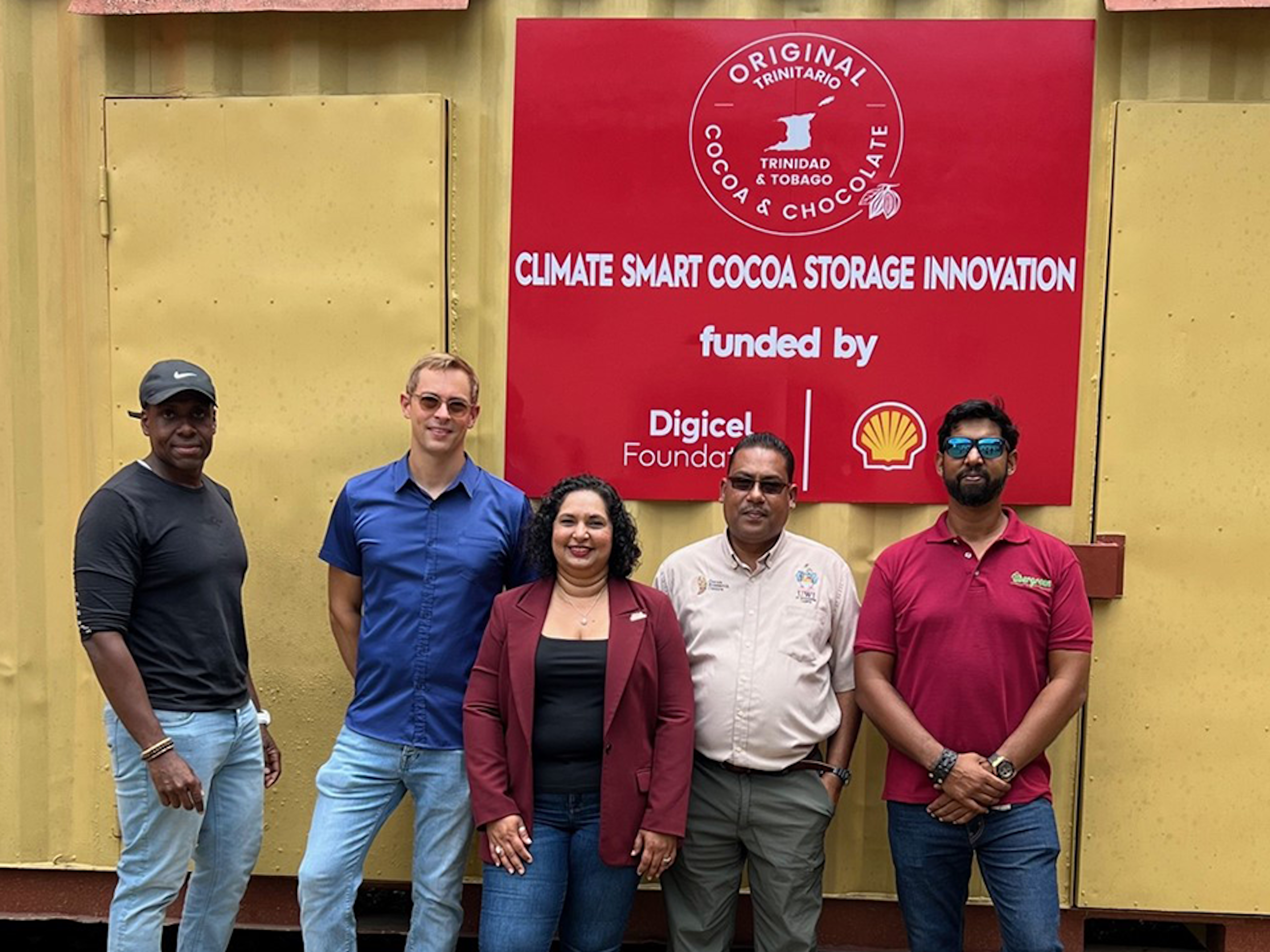 5 persons standing in front of renewable energy project