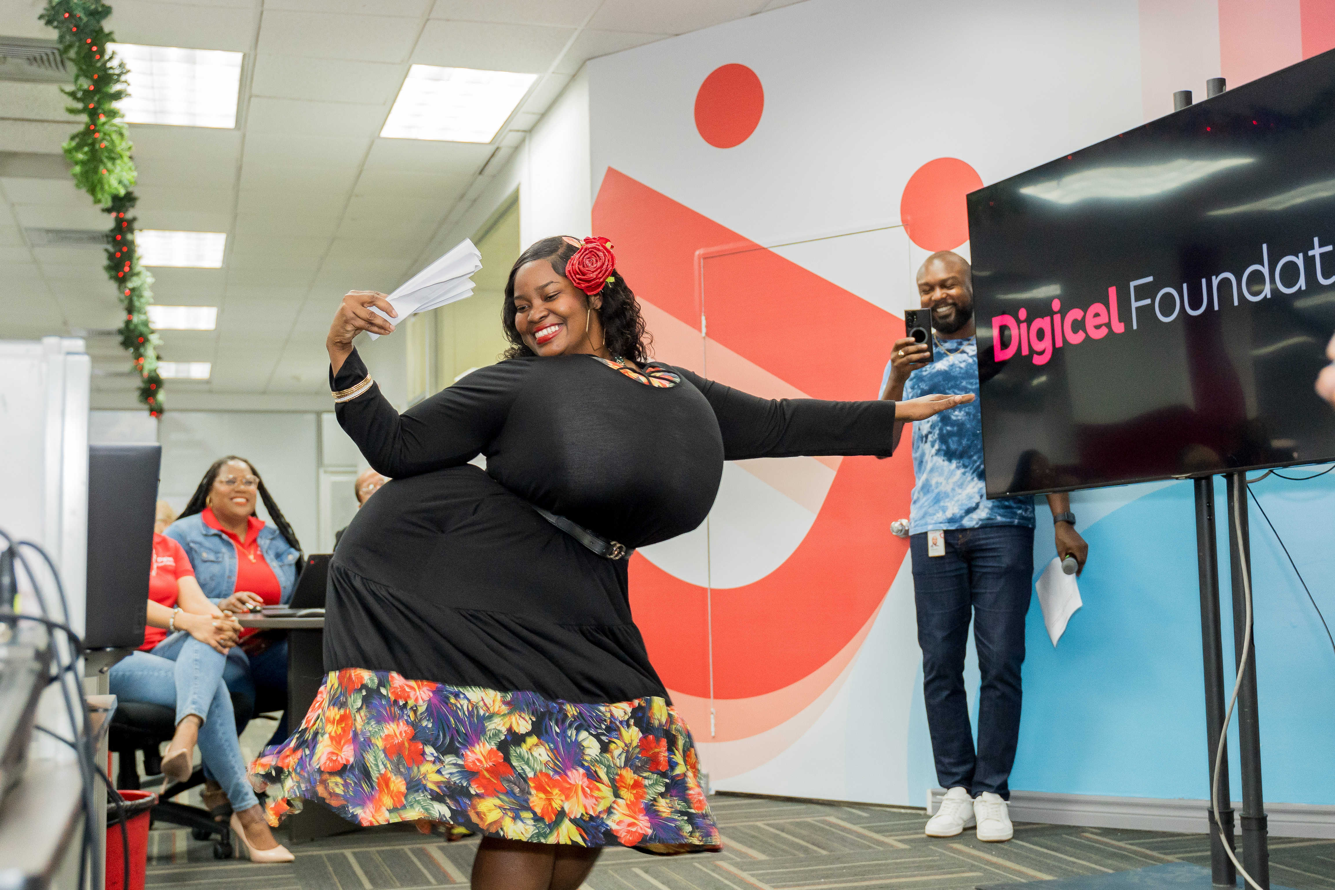 Digicel staff member dressed like a dame lorraine