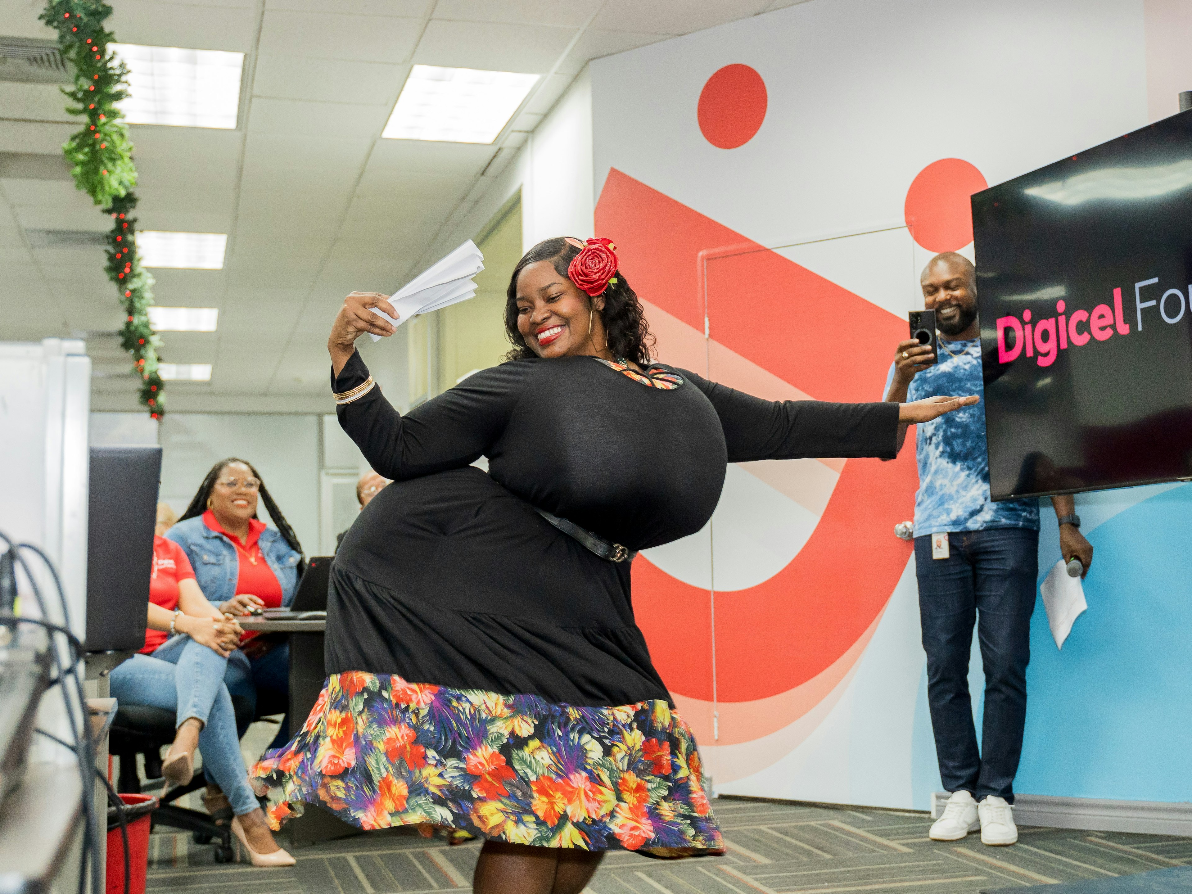 Digicel staff member dressed like a dame lorraine