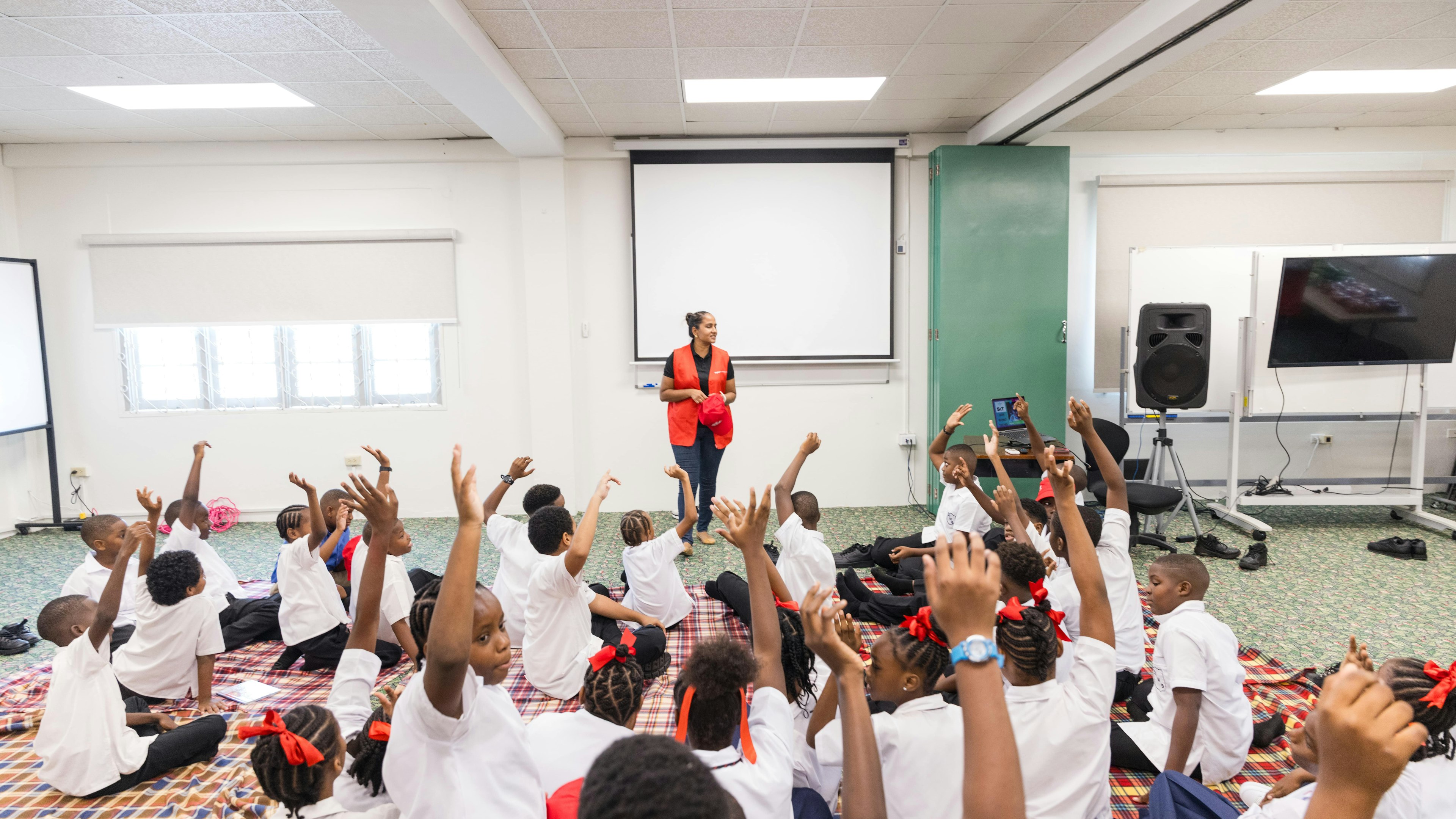 Digicel staff facilitating safer internet sessions with students