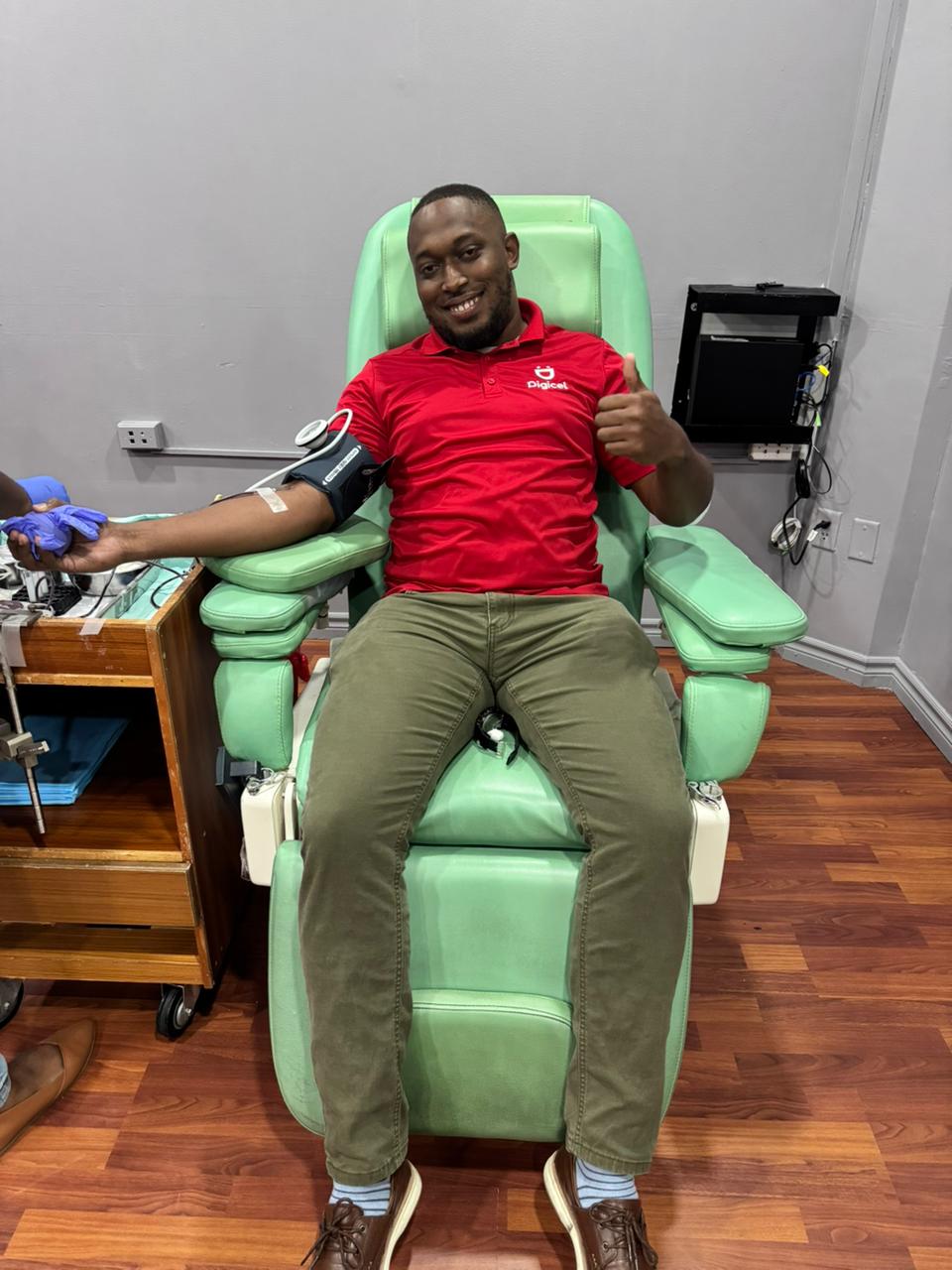 Digicel employee donating blood