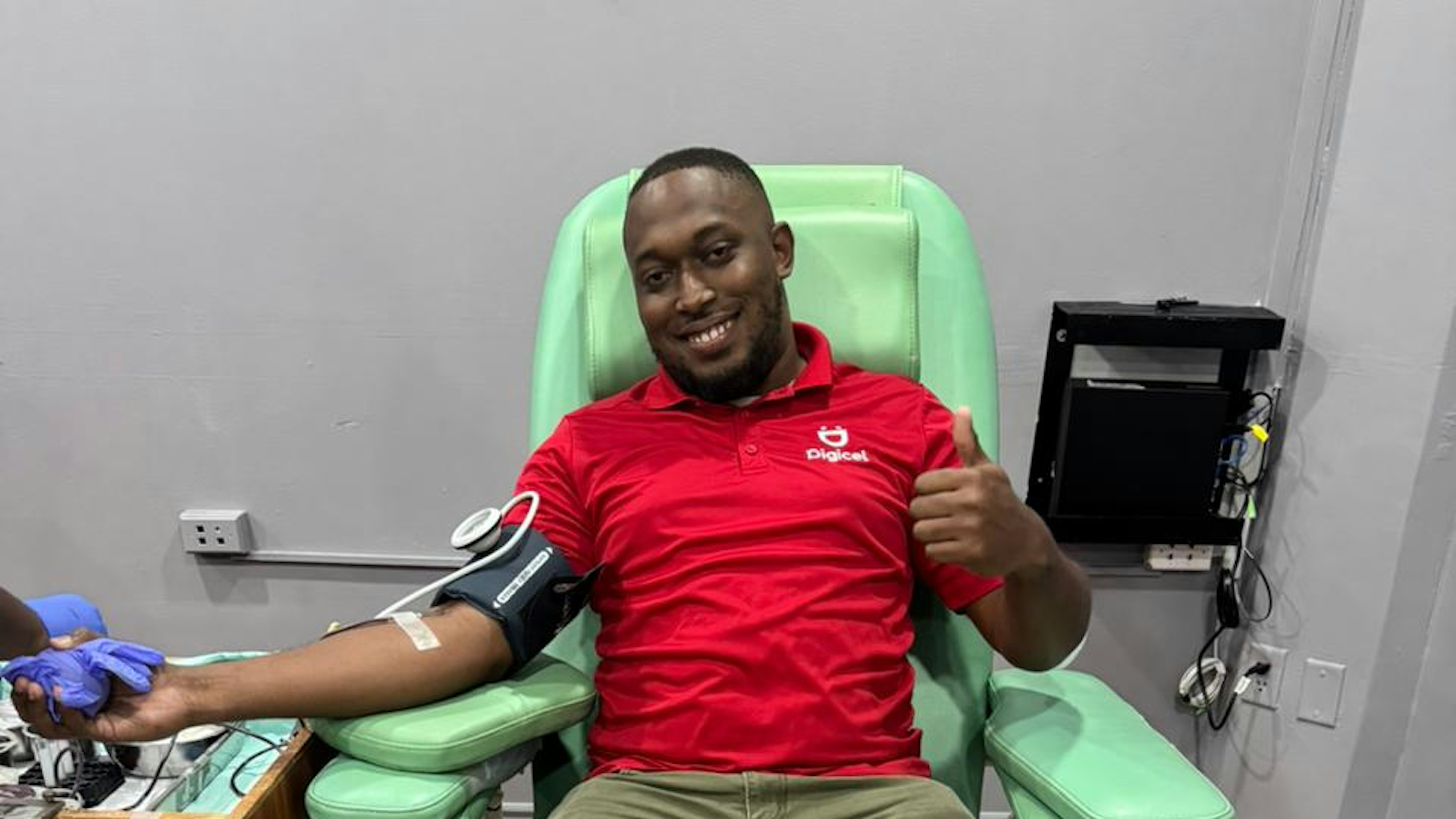 Digicel employee donating blood