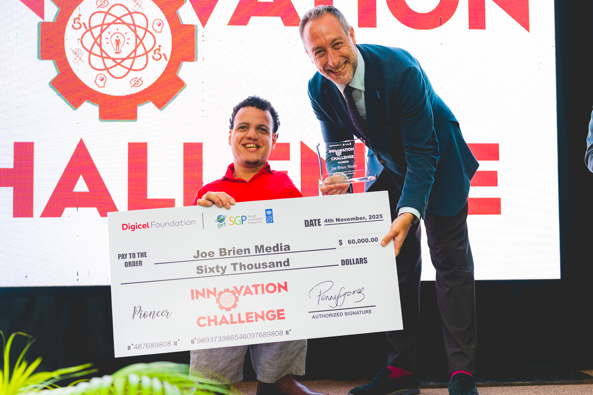 UN resident representative presents cheque to Joe Brien