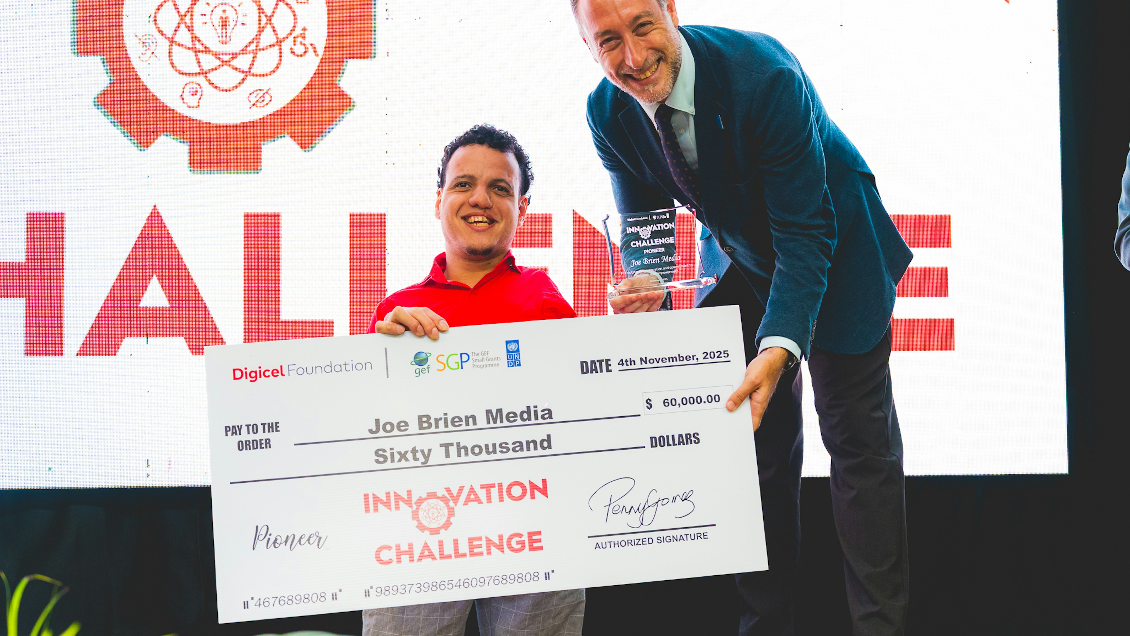 UN resident representative presents cheque to Joe Brien