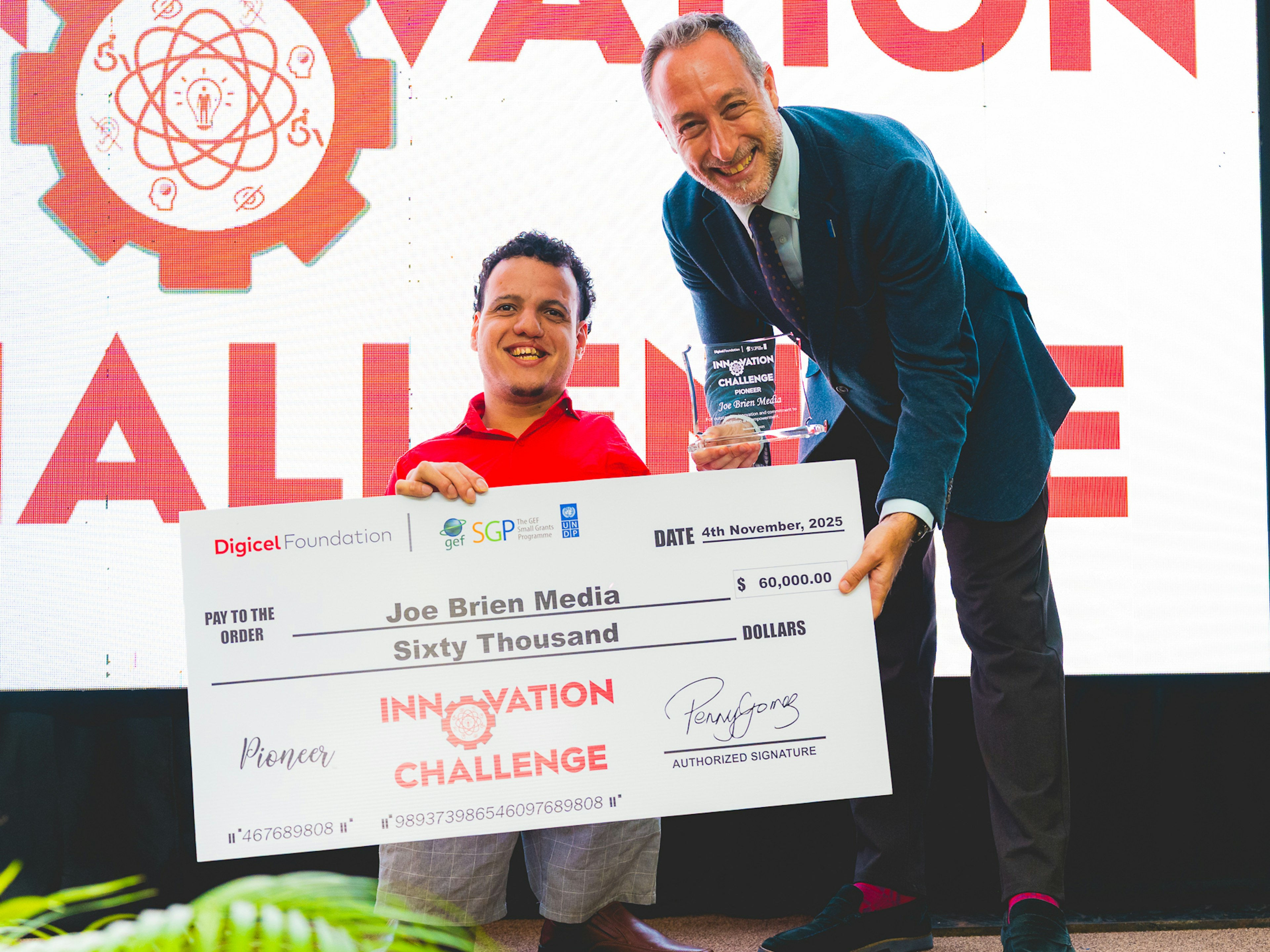 UN resident representative presents cheque to Joe Brien