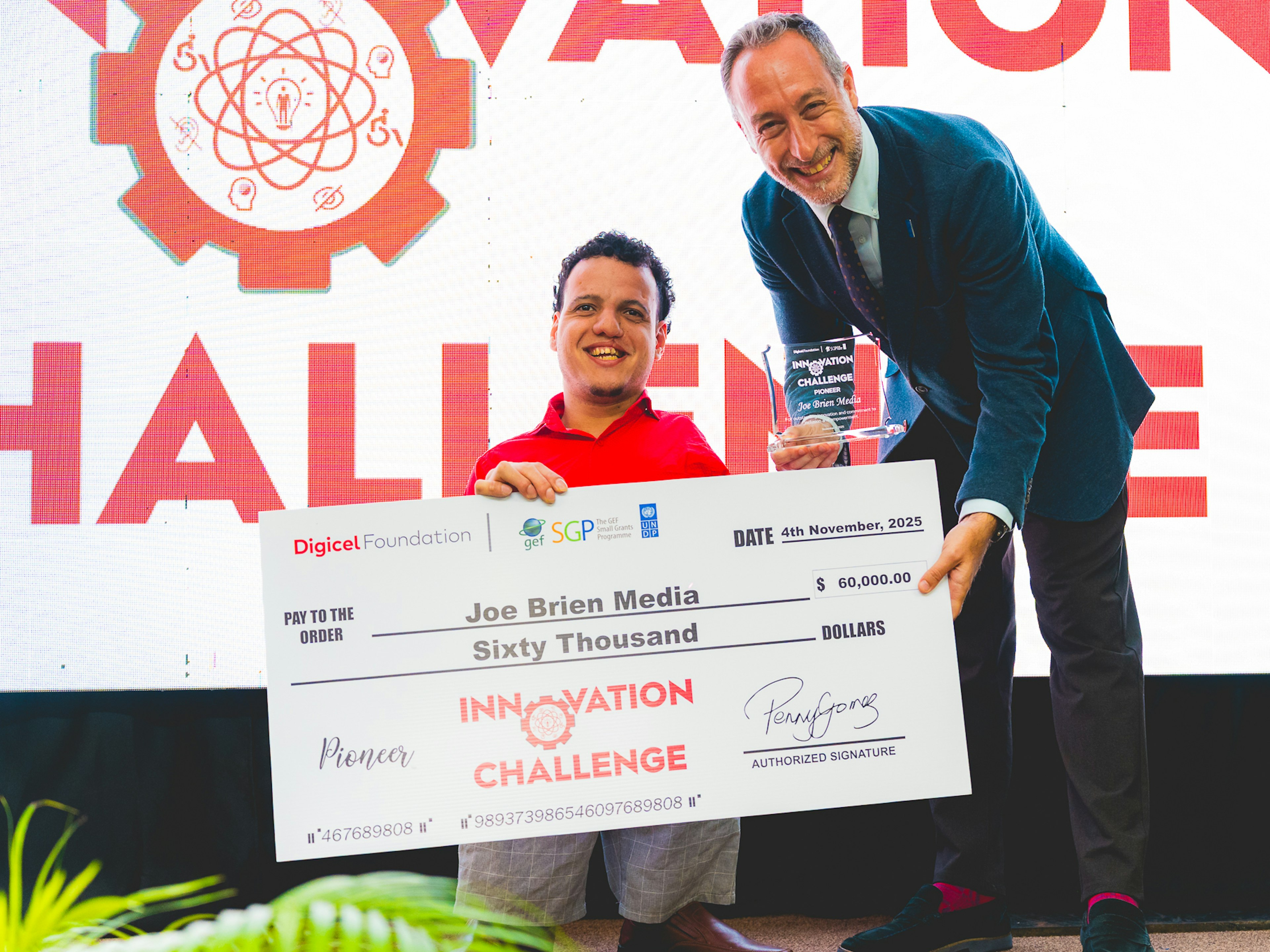 UN resident representative presents cheque to Joe Brien