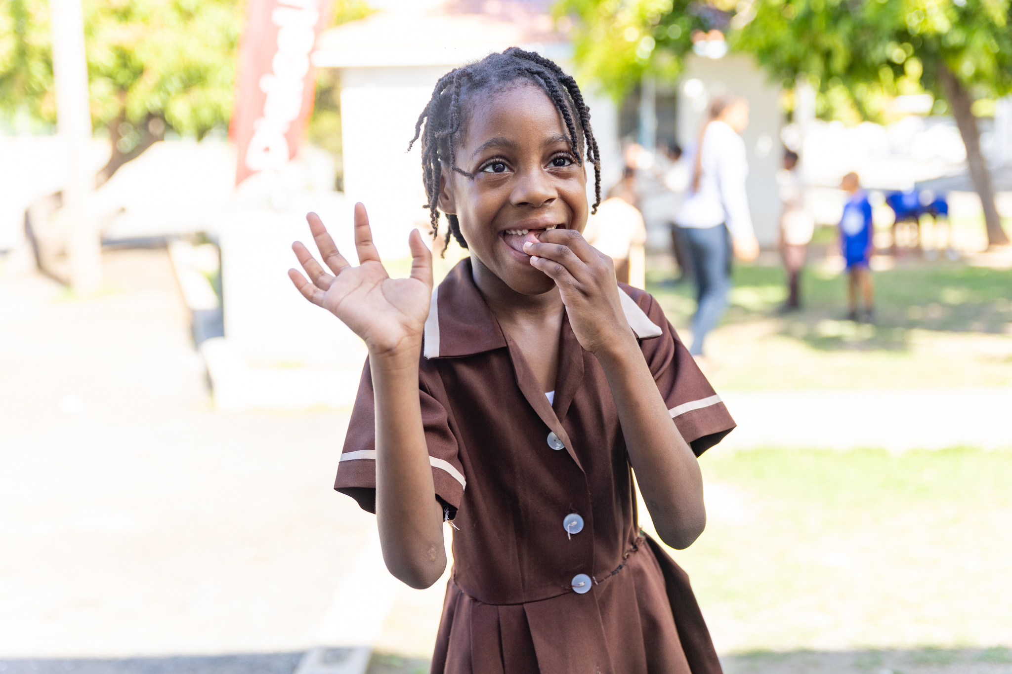 girl waving