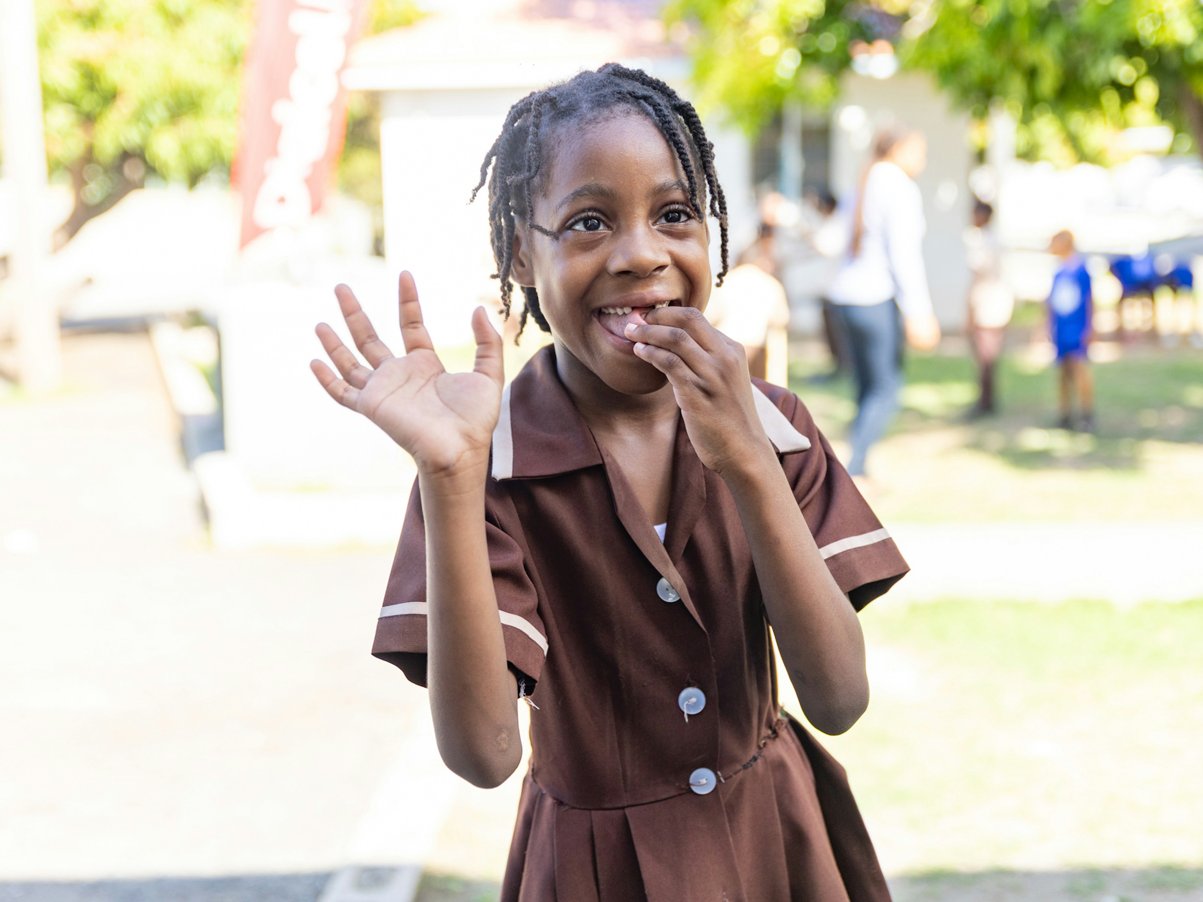 girl waving