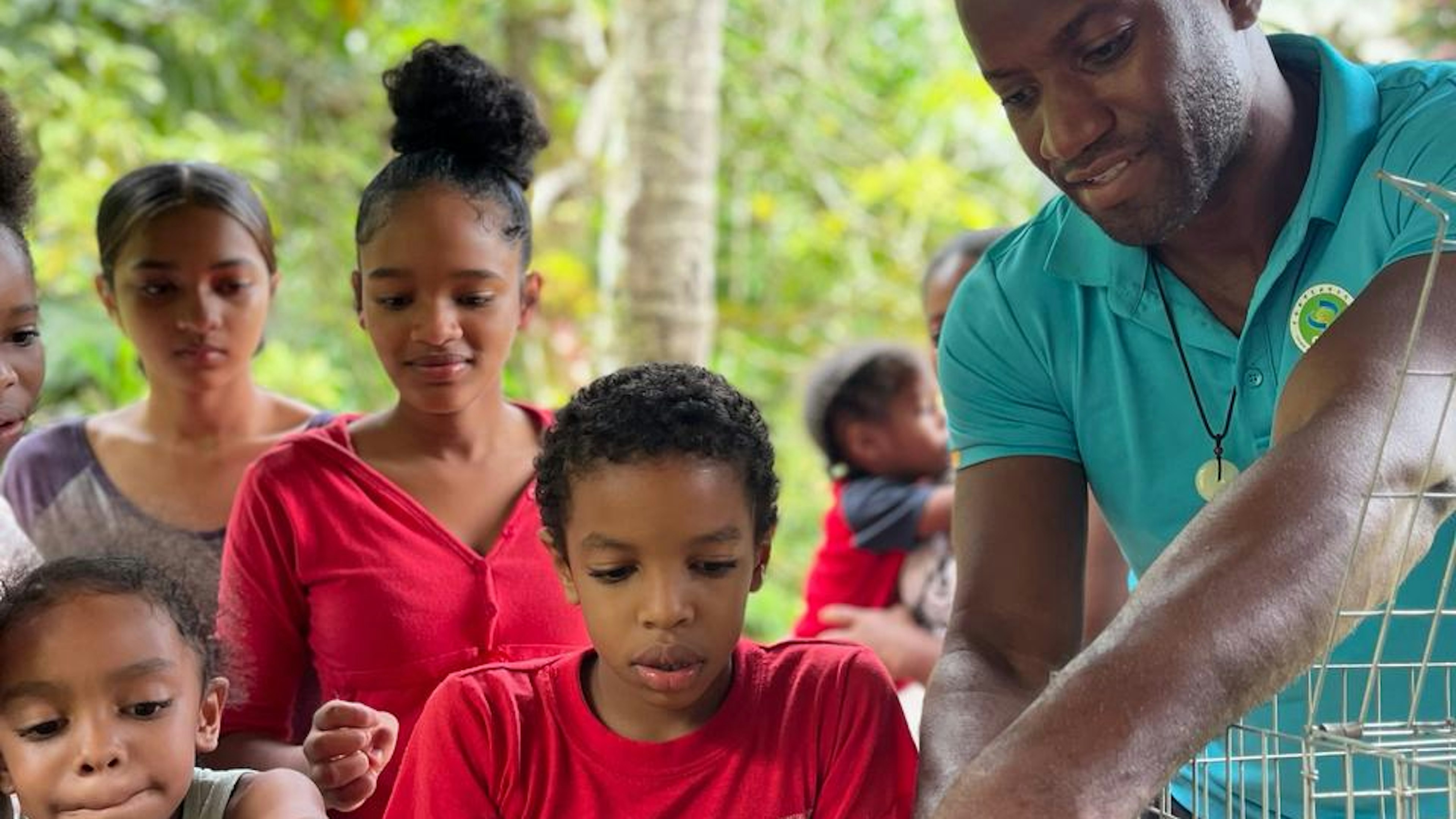 man and children with rabbits