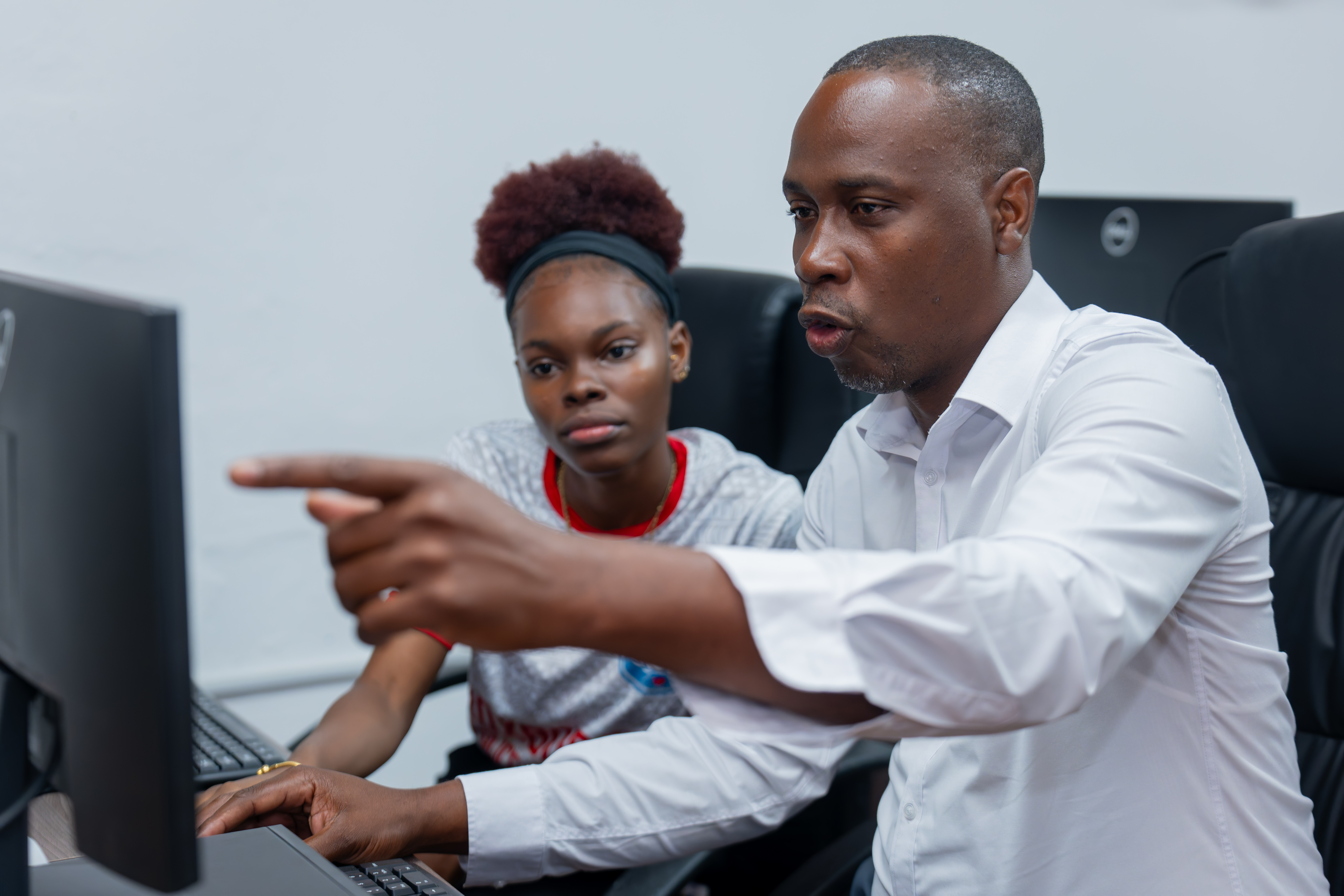 Man using computer with youth