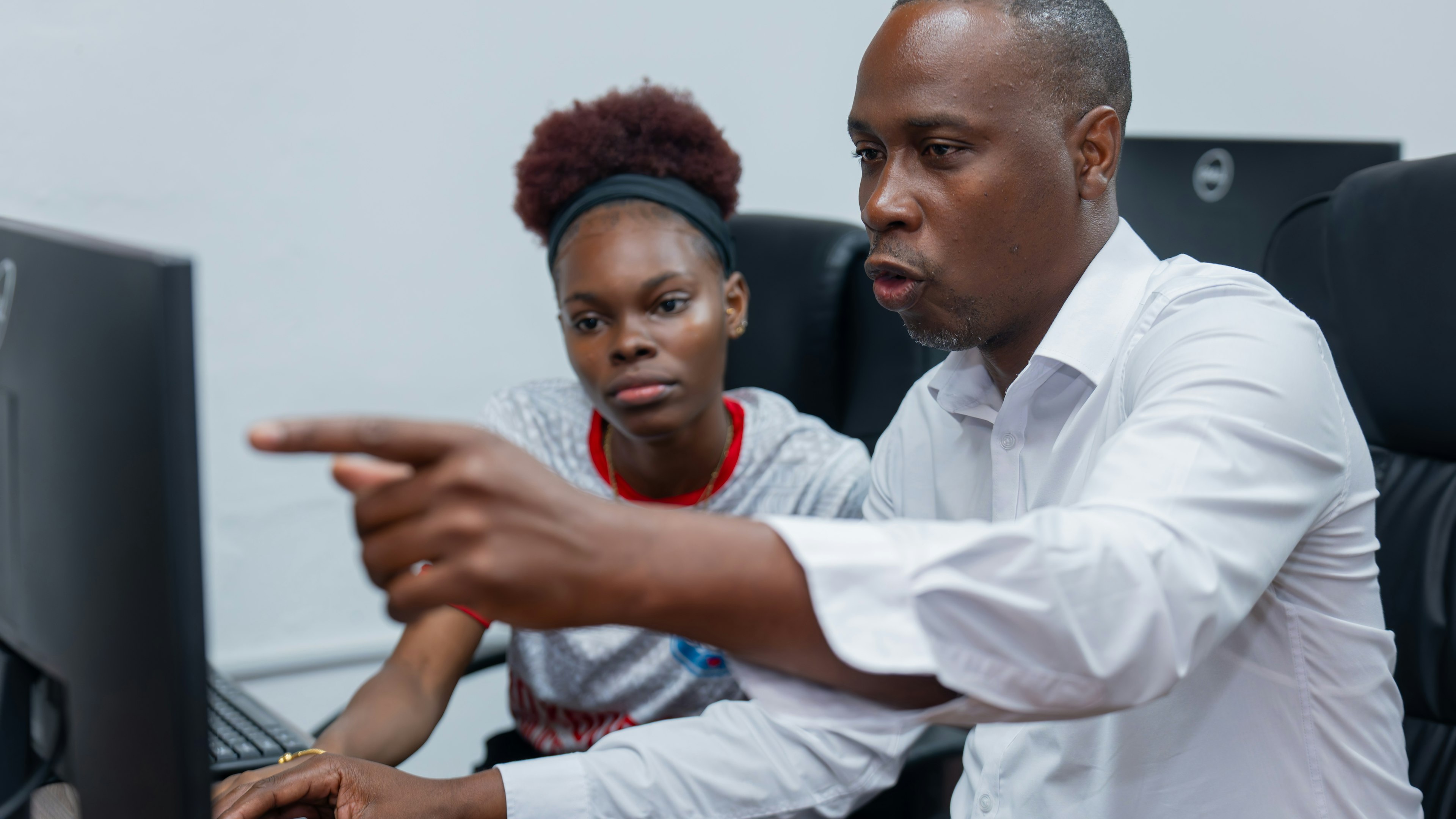 Man using computer with youth