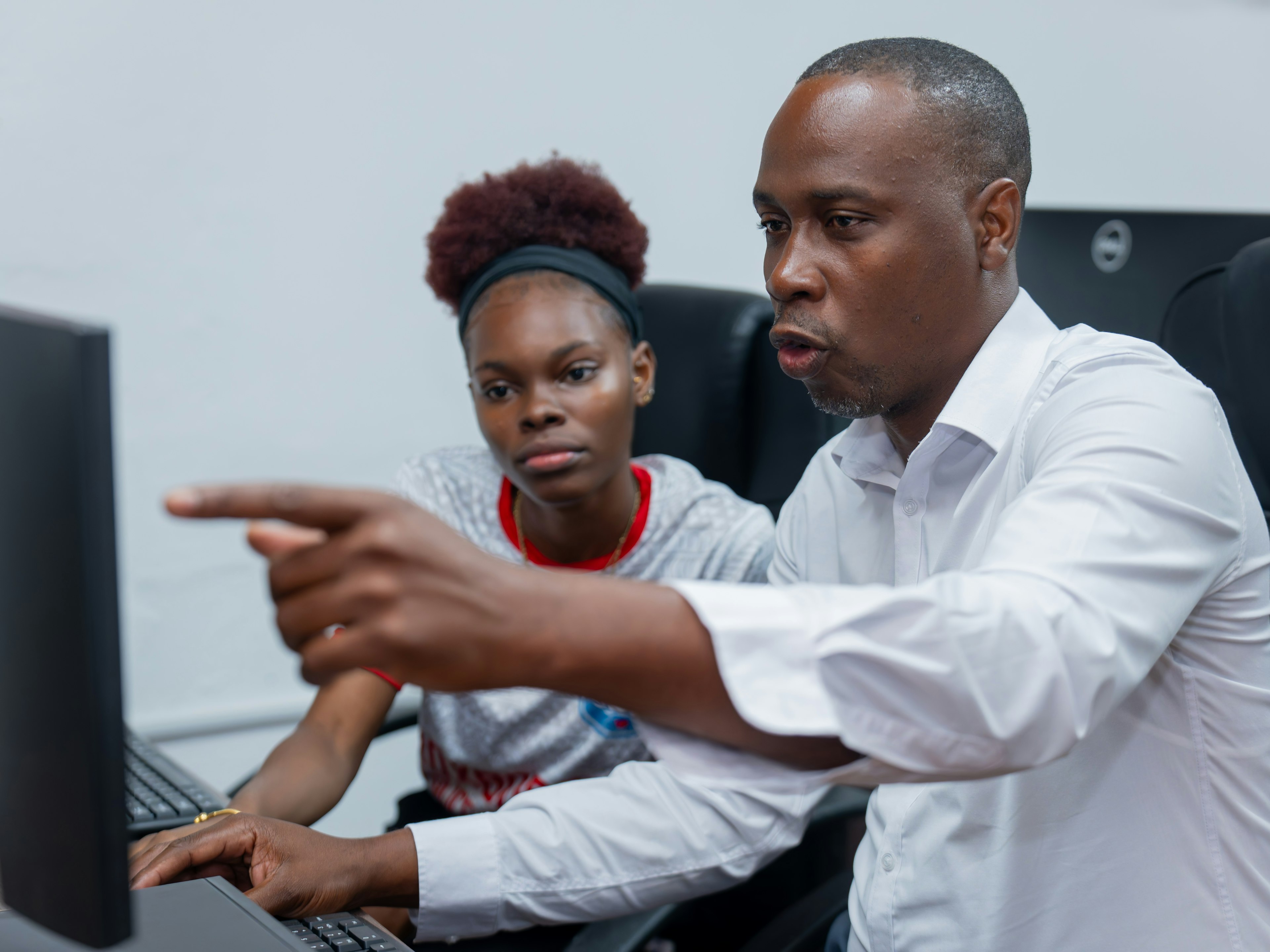 Man using computer with youth