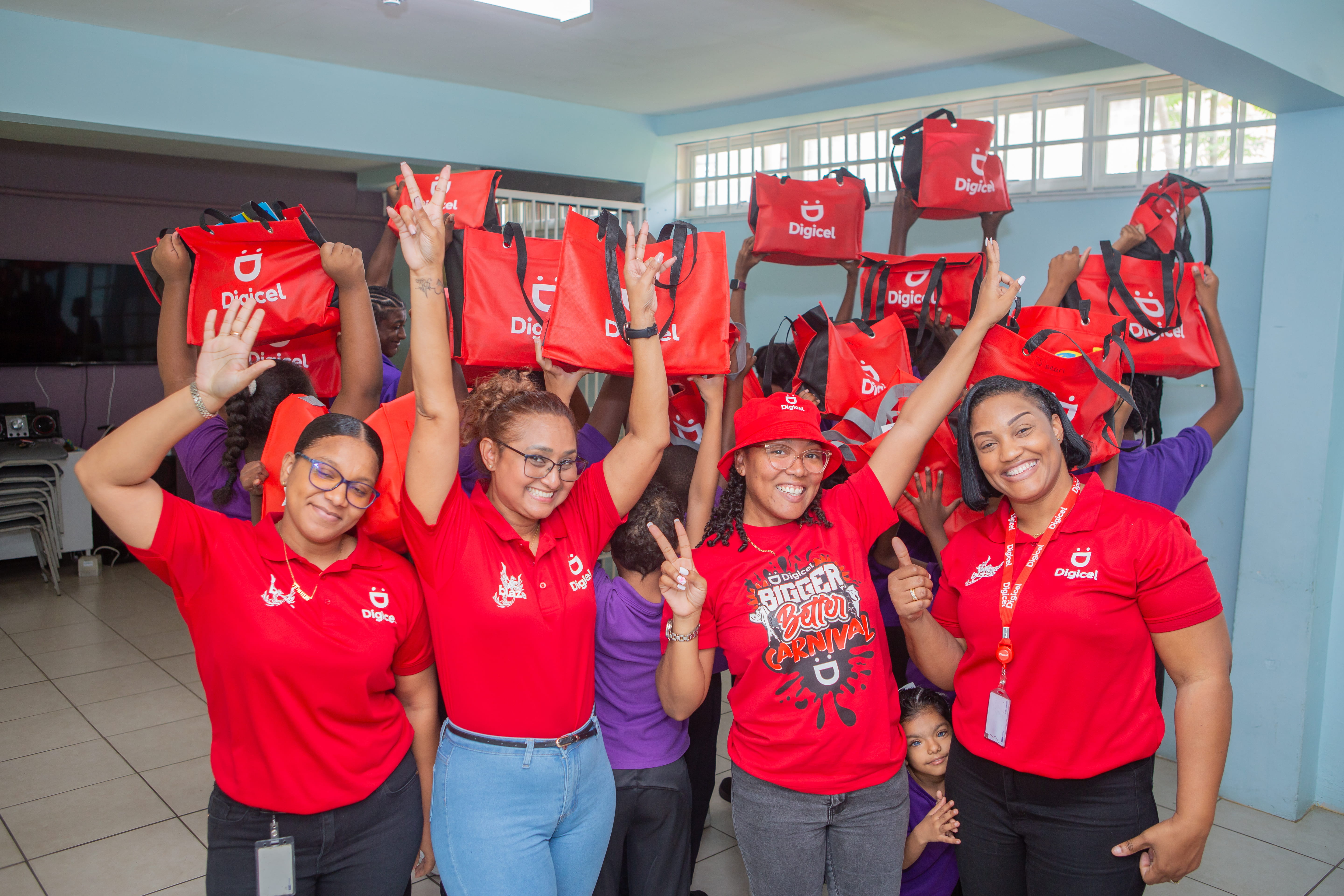 a group of Digicel staff members posing for camera