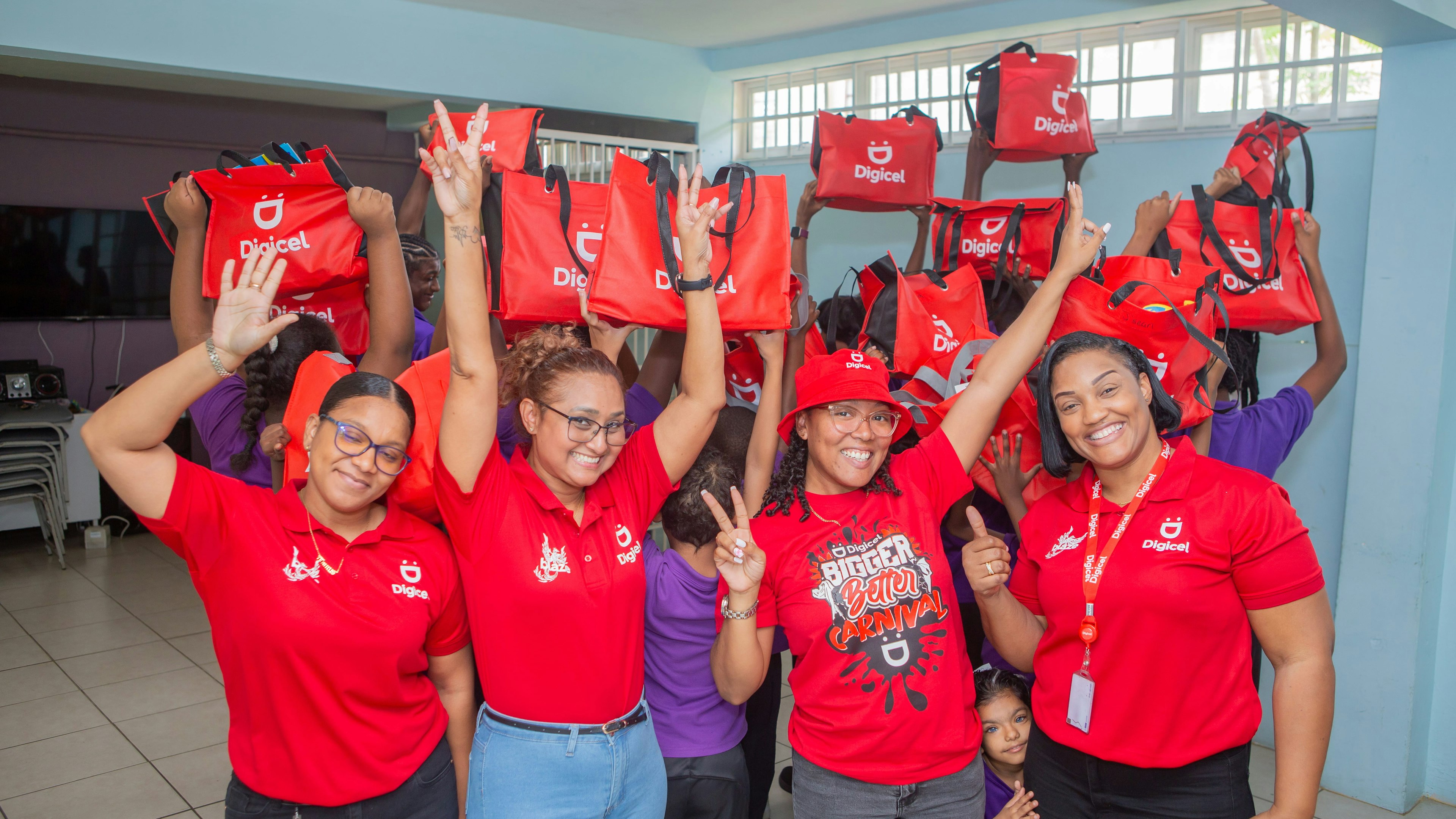 a group of Digicel staff members posing for camera