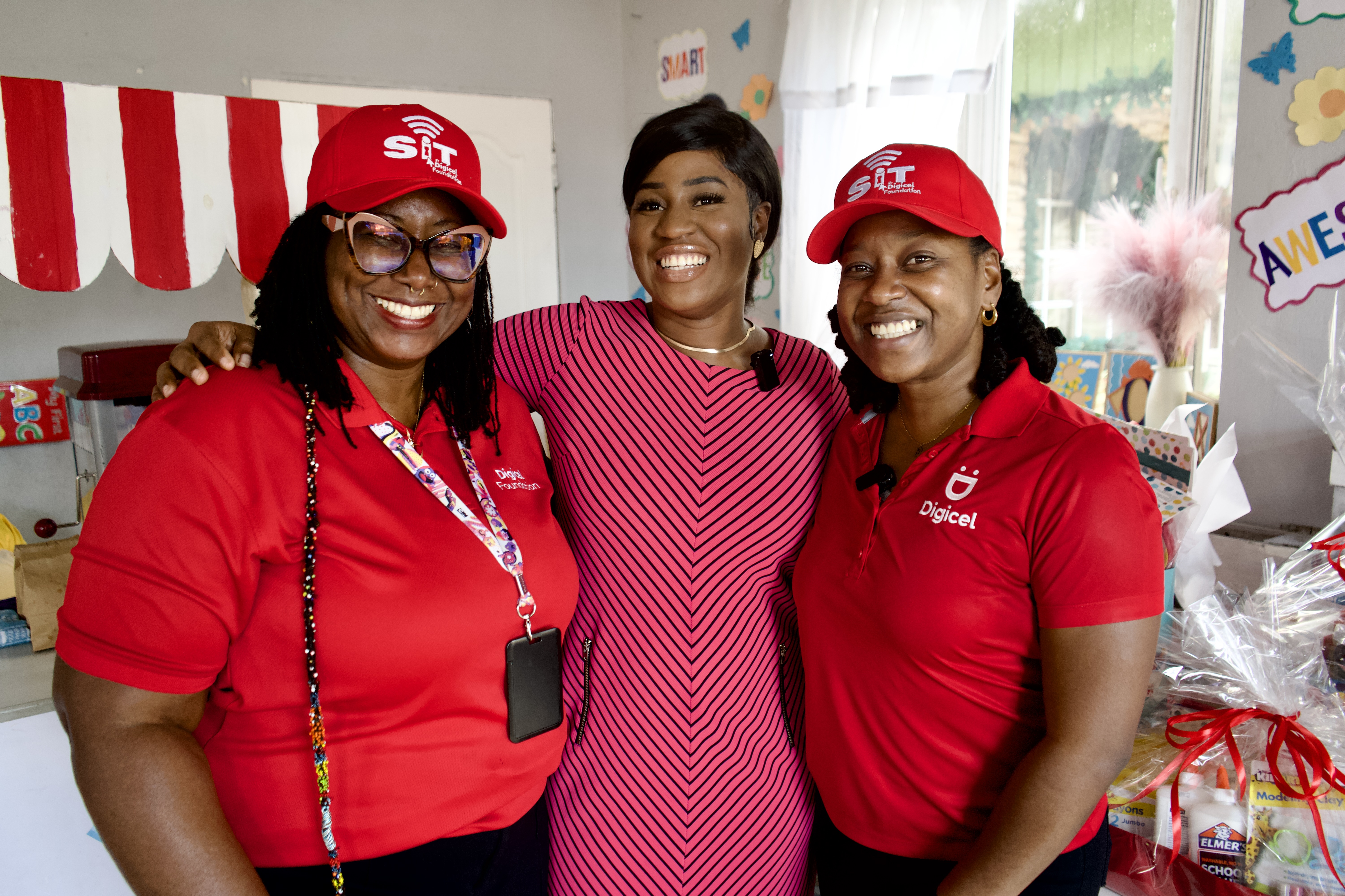 Digicel staff pose with pre school principal