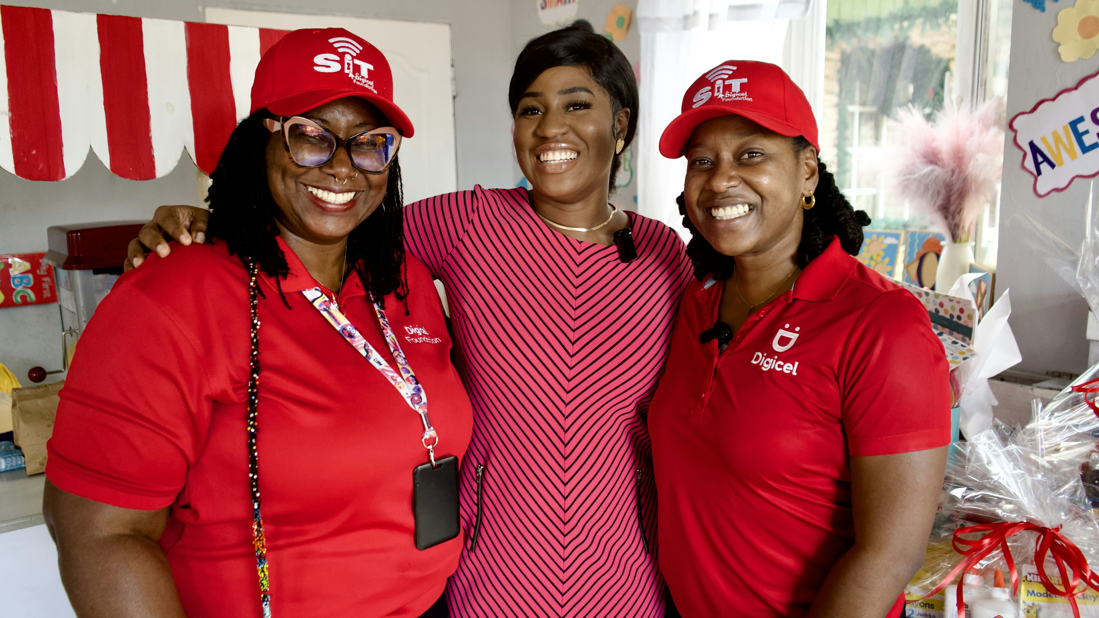 Digicel staff pose with pre school principal