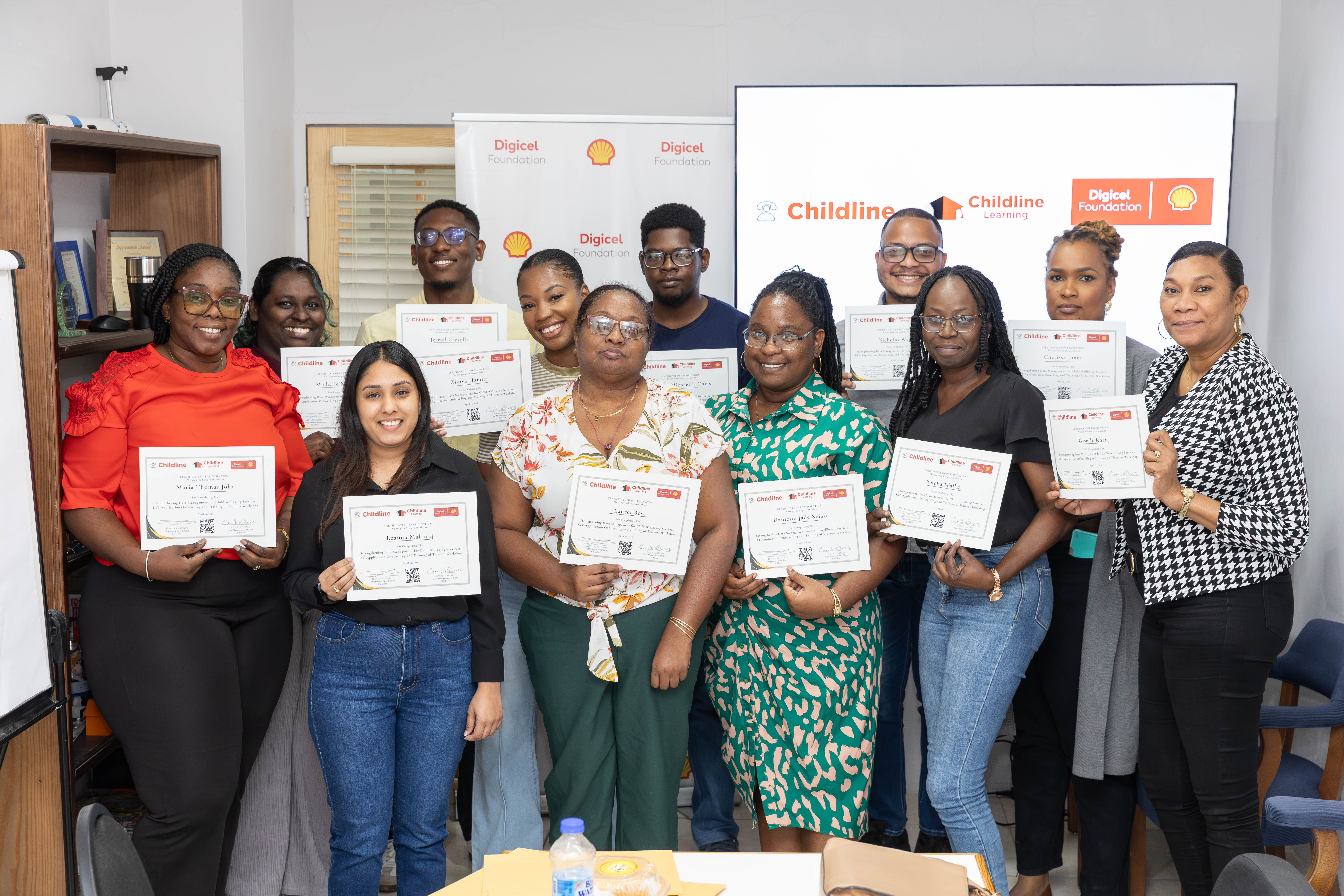 childline volunteers pose with training certificates