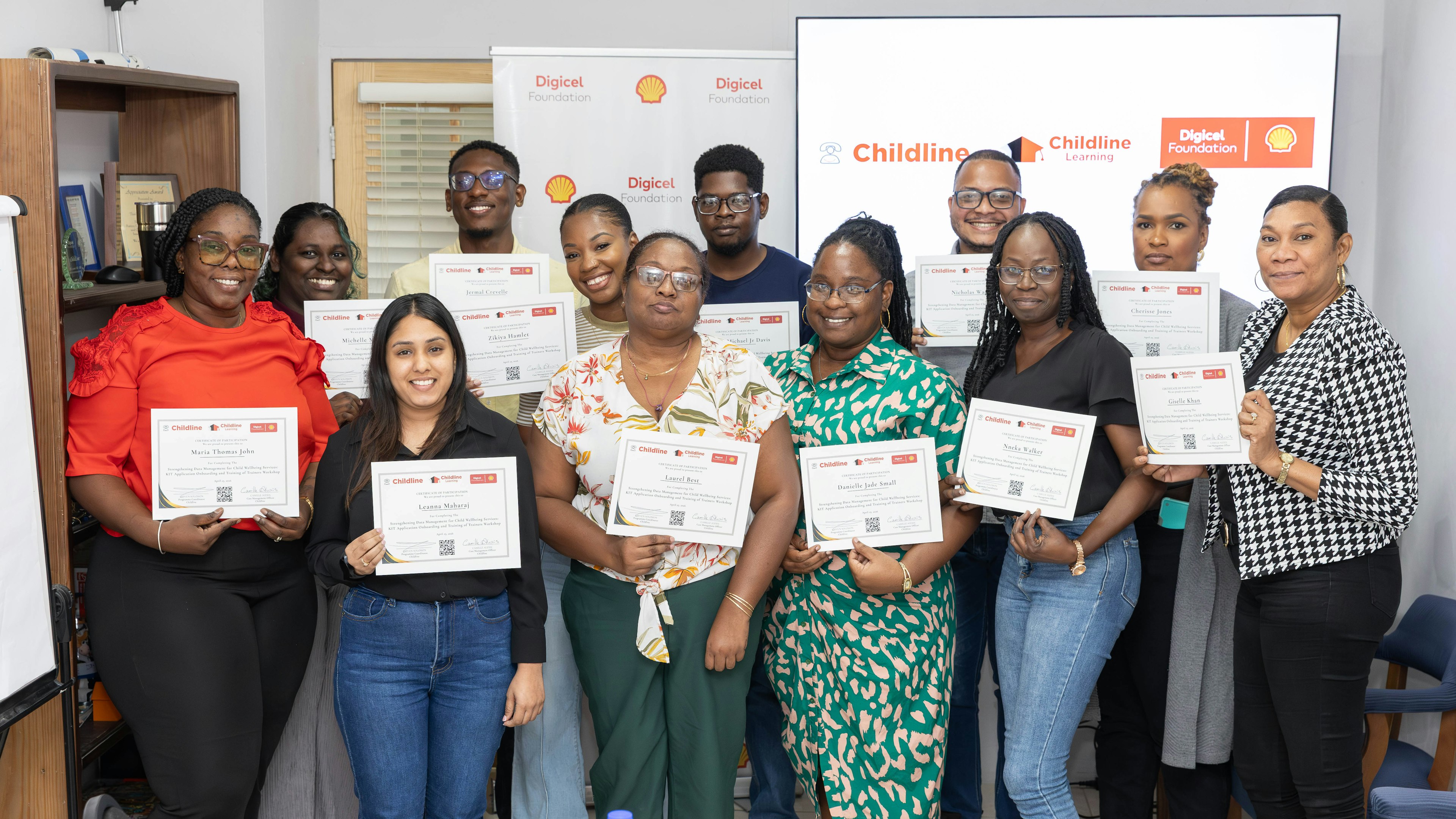 childline volunteers pose with training certificates