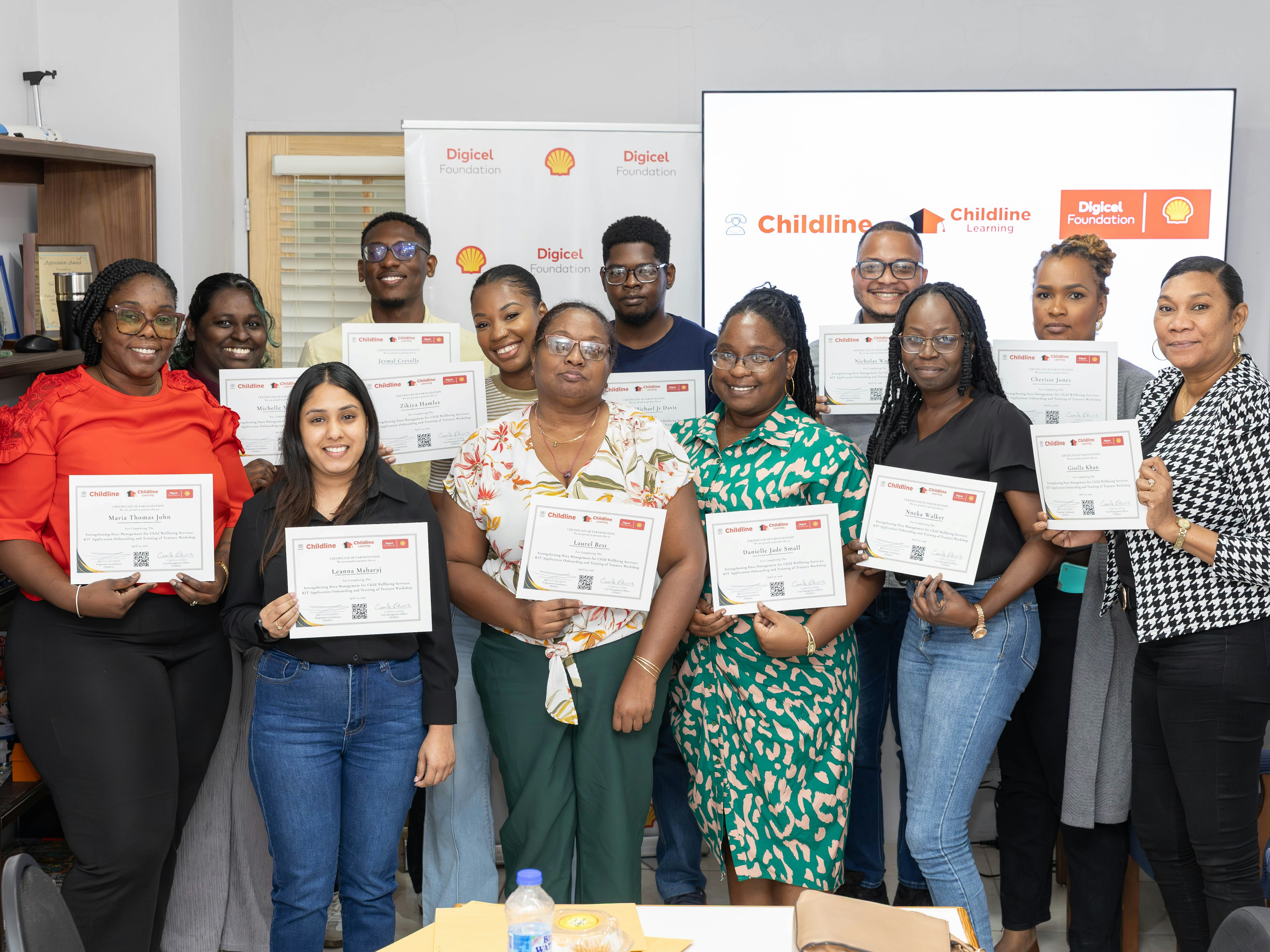 childline volunteers pose with training certificates