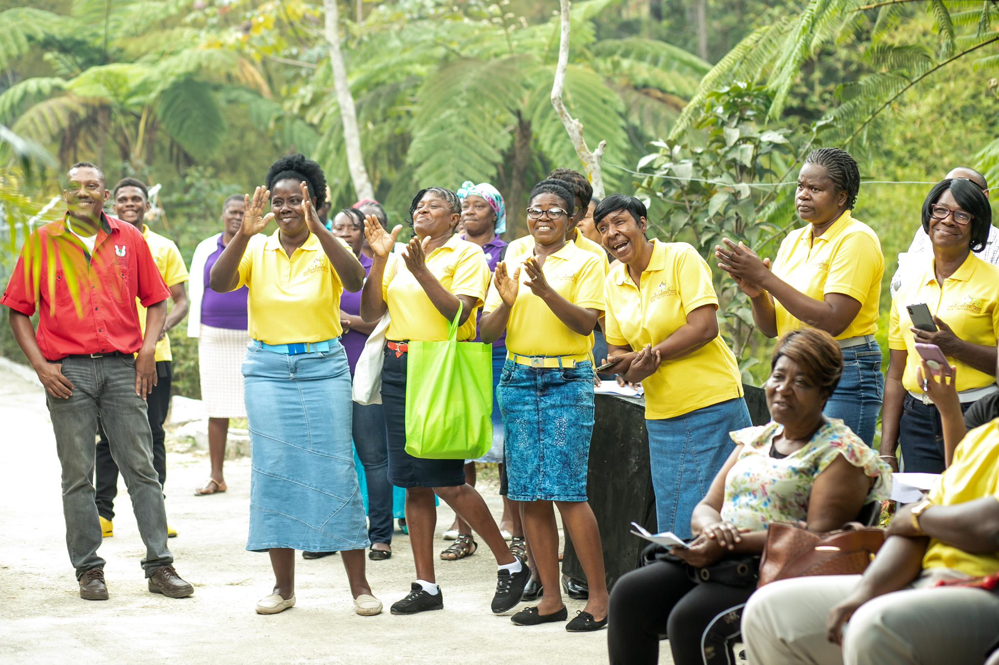 people in yellow clapping