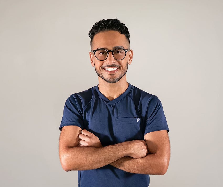 Dr. Al-Mufarrej smiling with his arms crossed