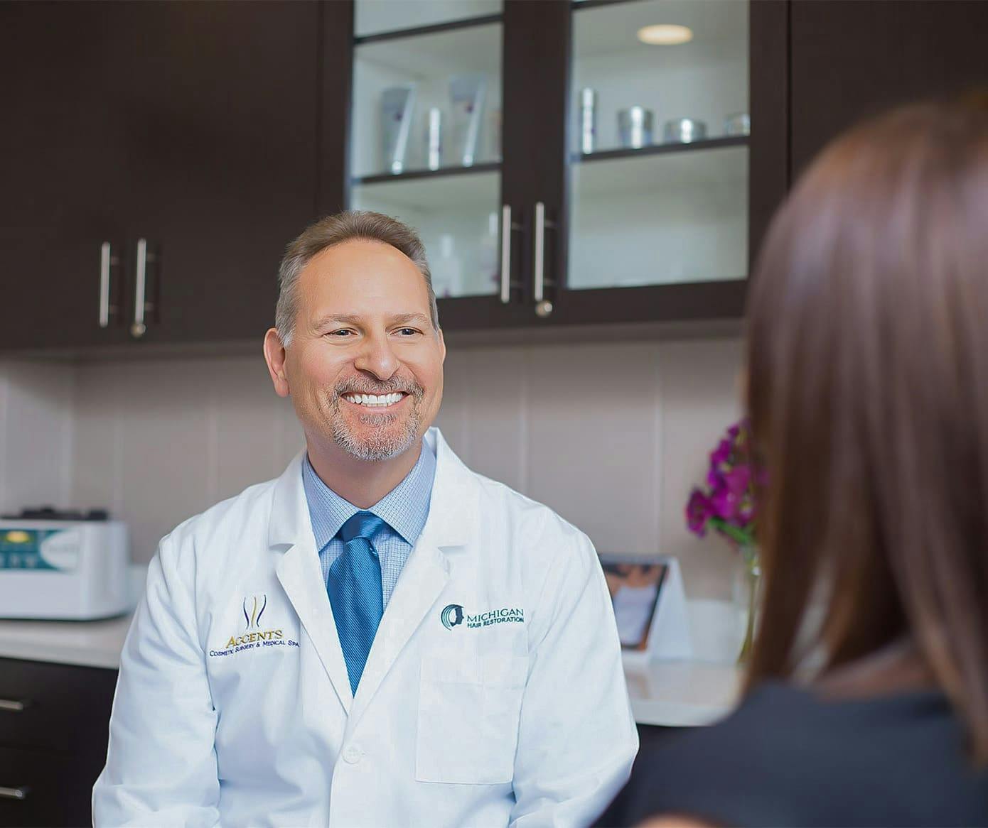 Dr. Berkowitz smiling at patient