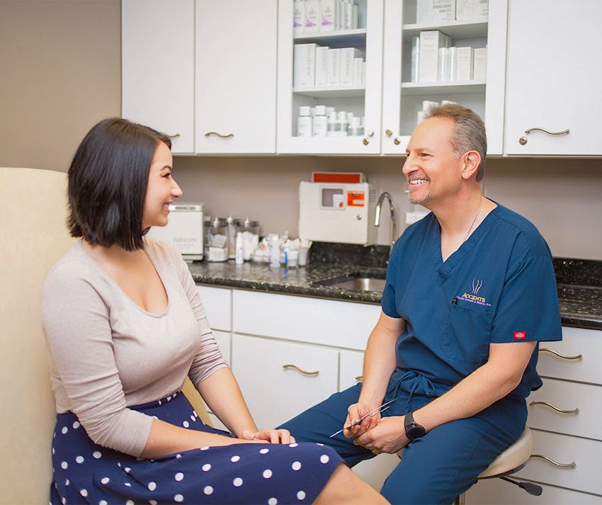 Dr. Berkowitz speaking with female patient