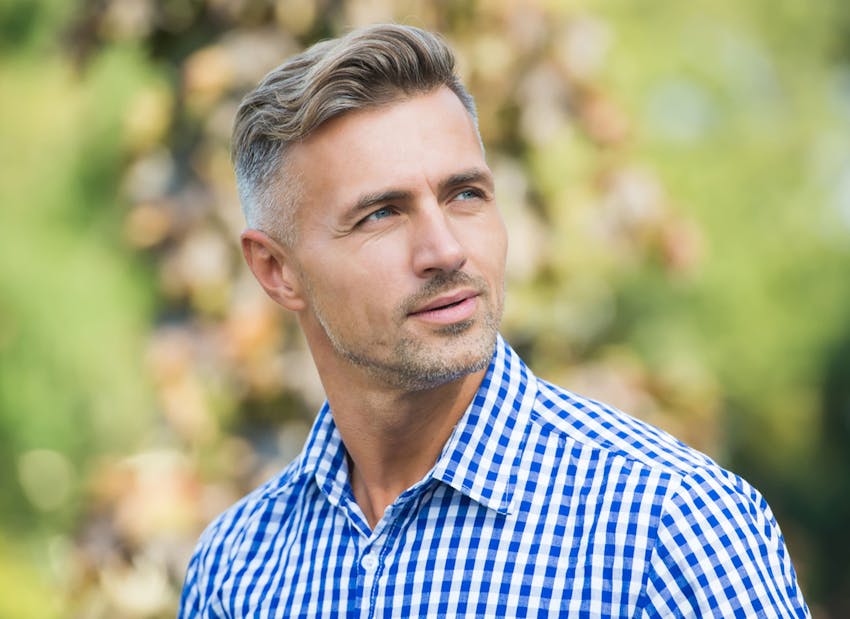 man in blue plaid shirt